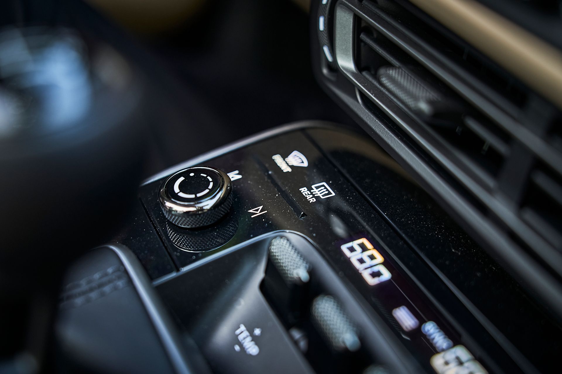 A close up of a car 's dashboard with a clock on it.