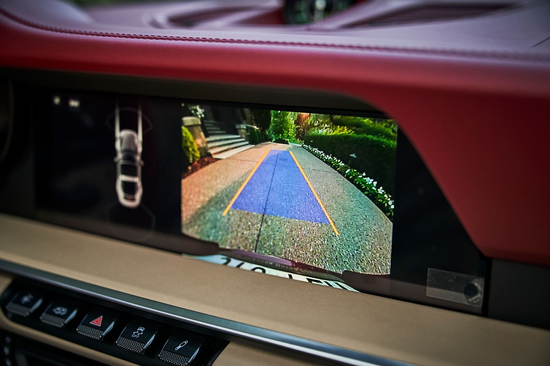 A rear view camera is displayed on the dashboard of a car.