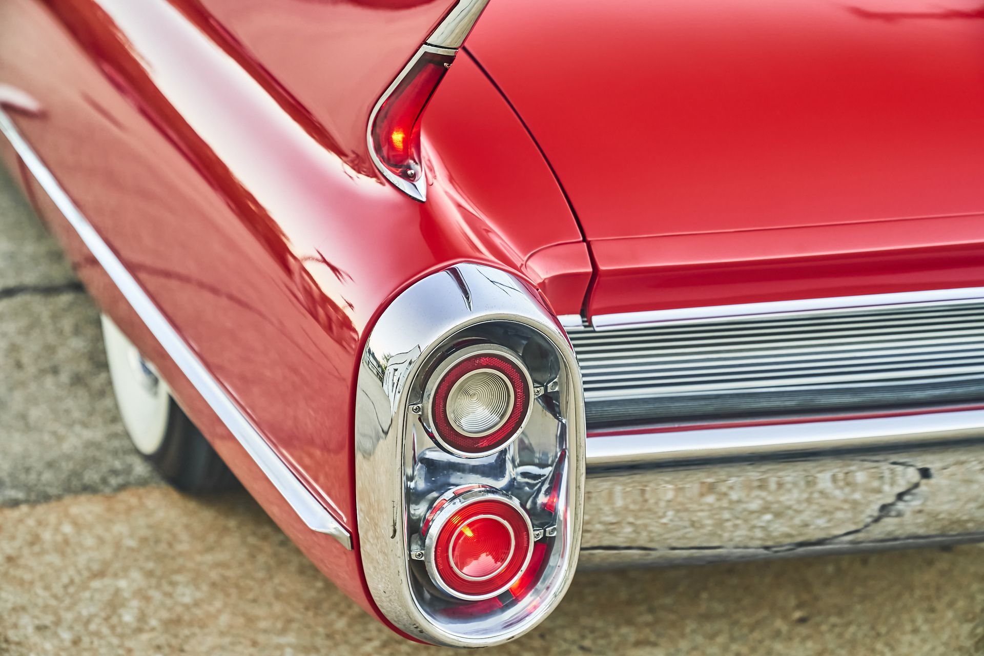 A close up of a red car 's tail light