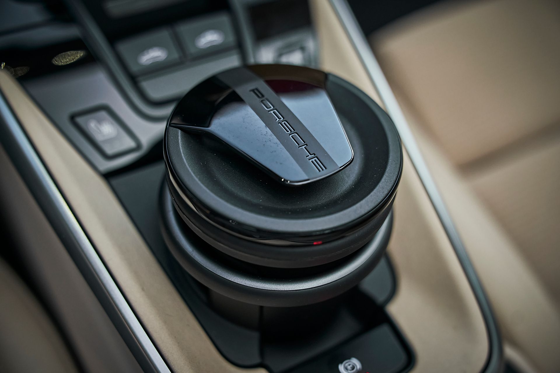 A close up of a steering wheel in a car.