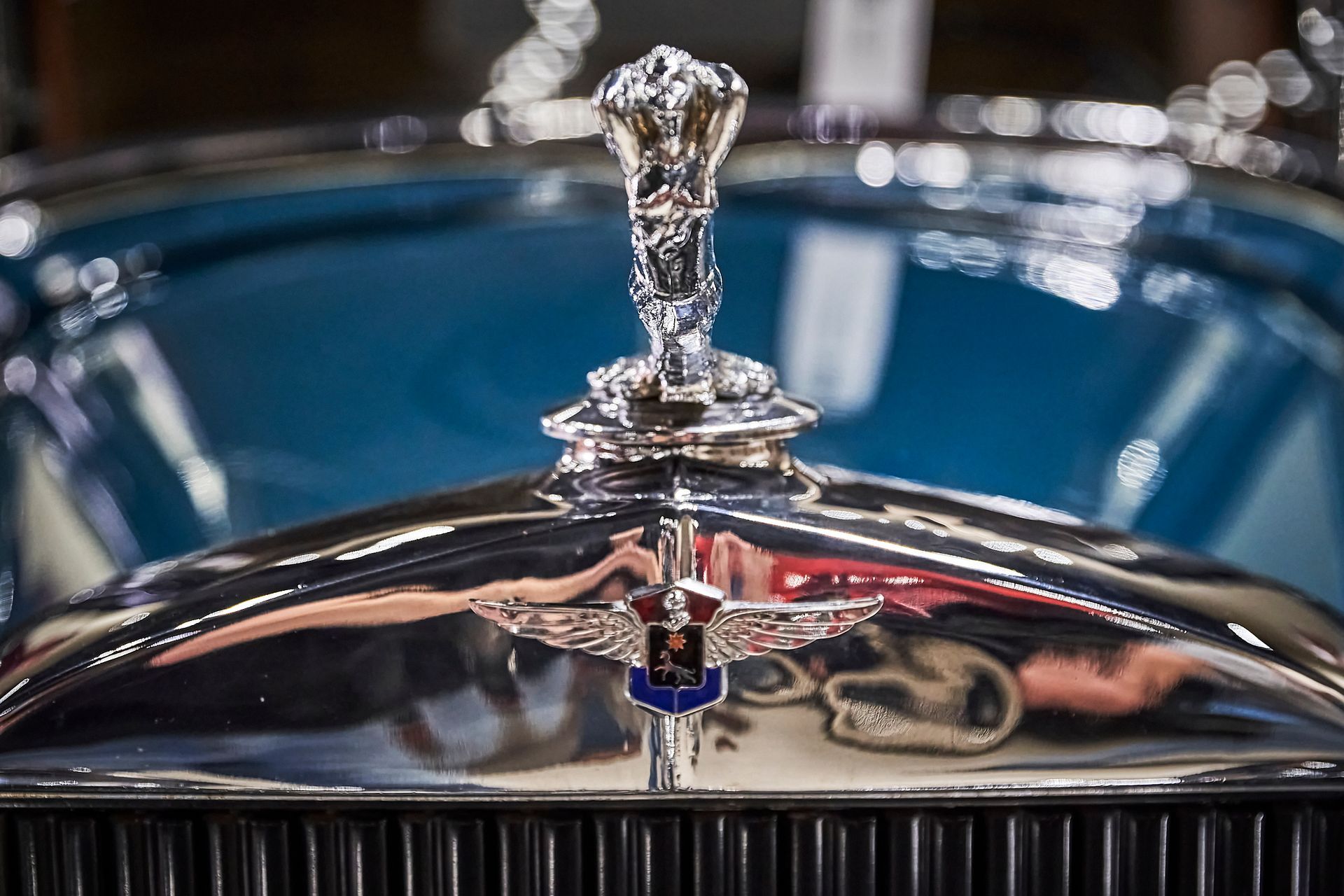 A close up of a car hood with a emblem on it