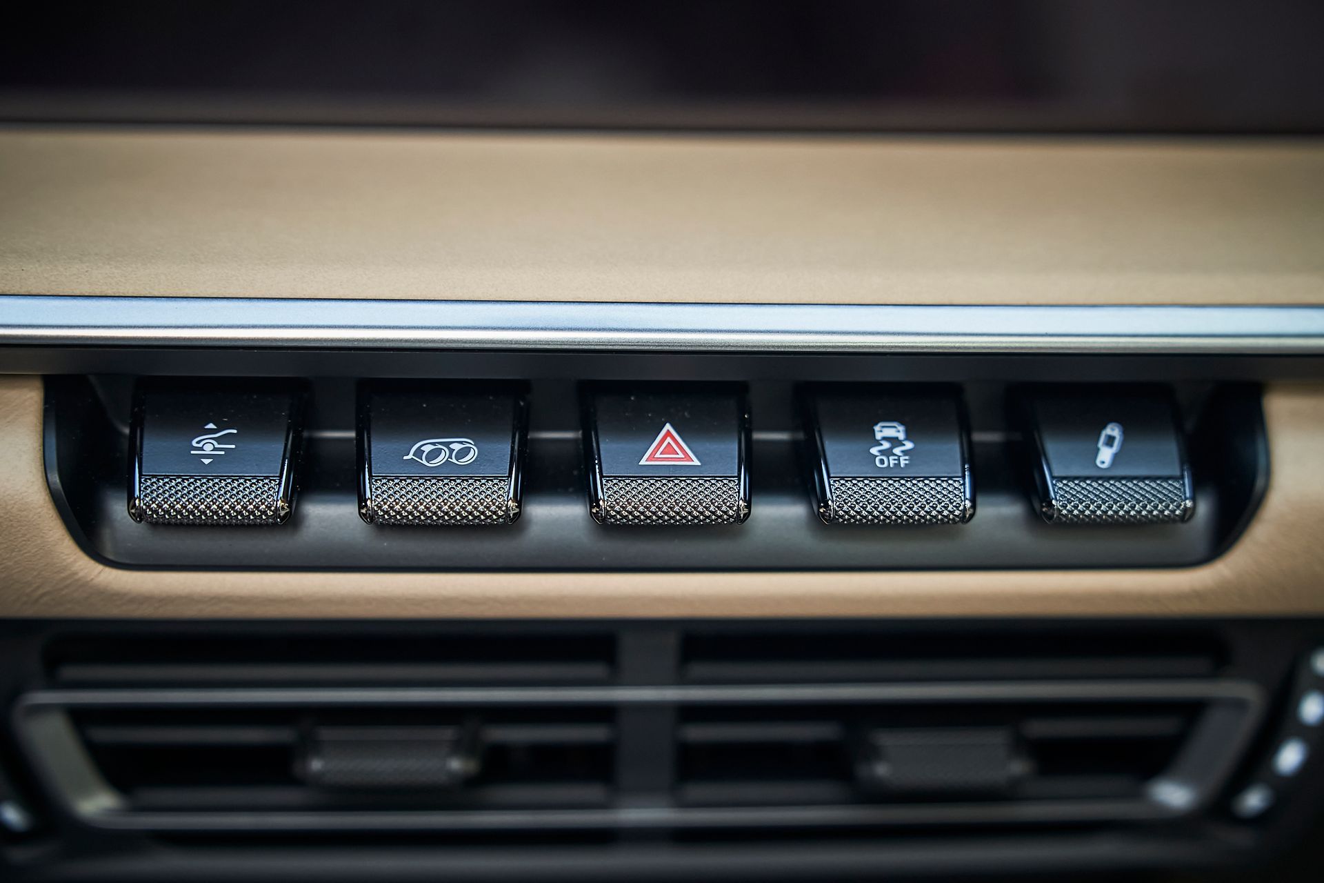 A close up of a car dashboard with a lot of buttons on it.
