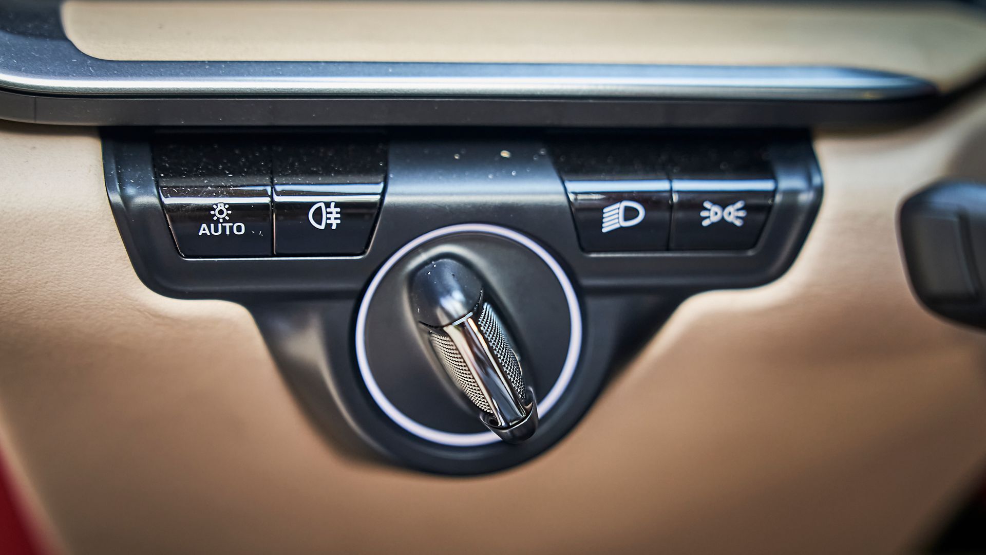 A close up of a car 's headlight switch