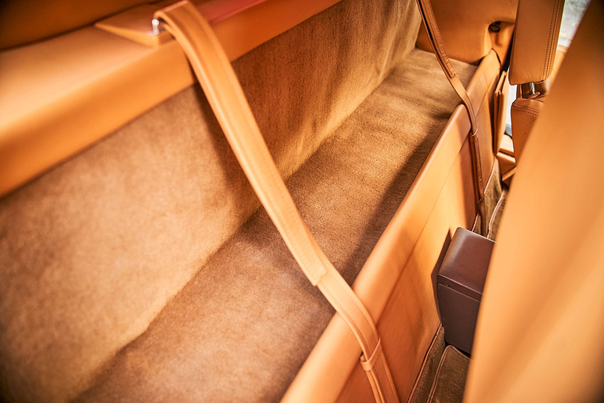 A close up of the back seat of a car.