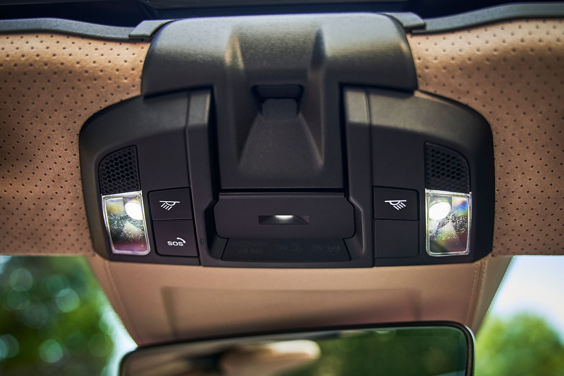 A close up of a ceiling light in a car.