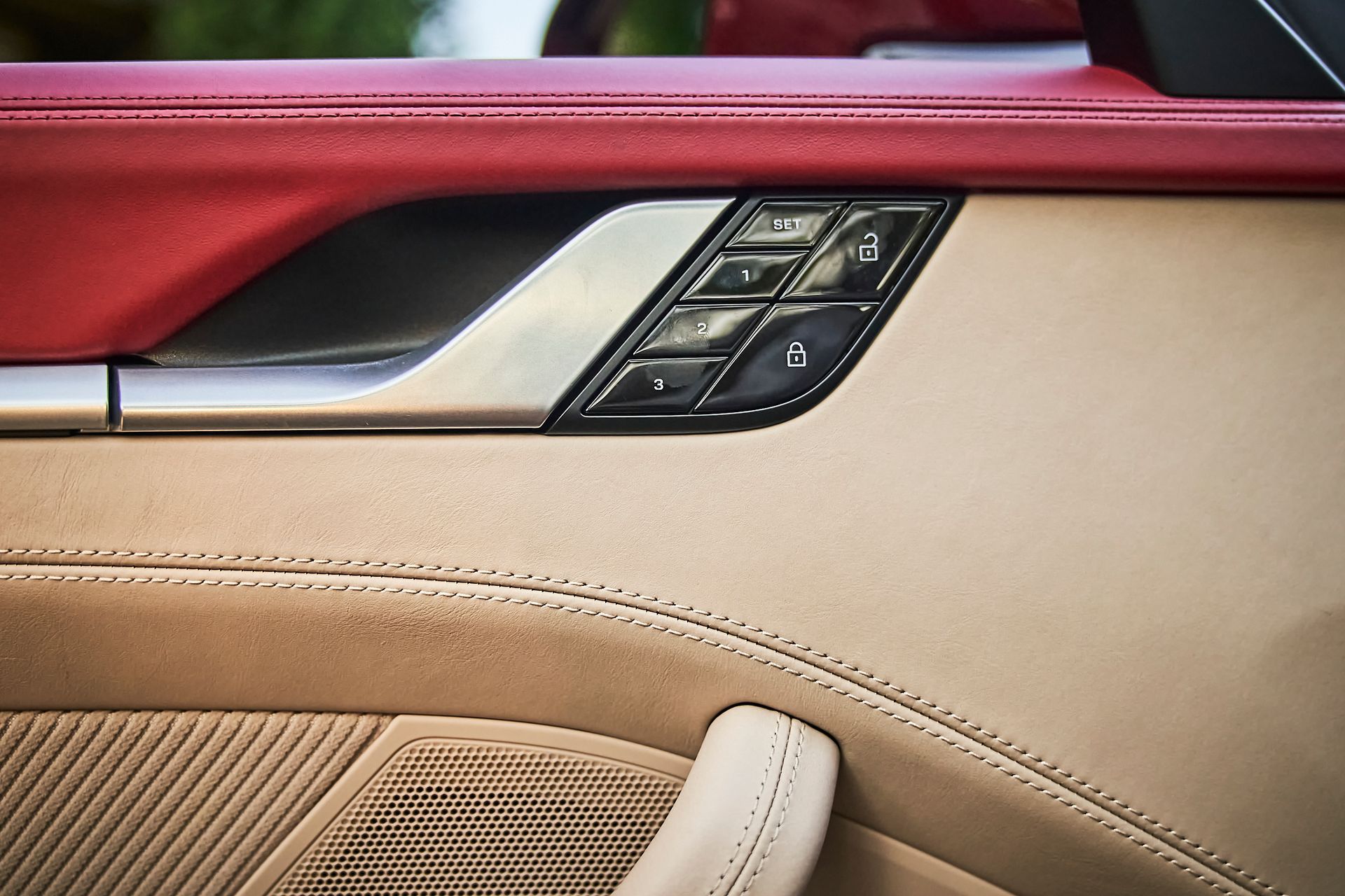 A close up of a car door with buttons on it