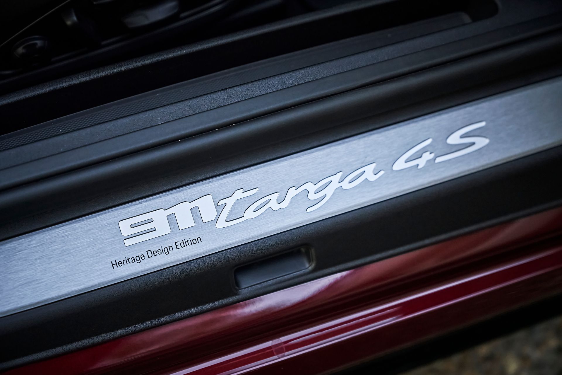 A close up of a porsche targa 4s door sill