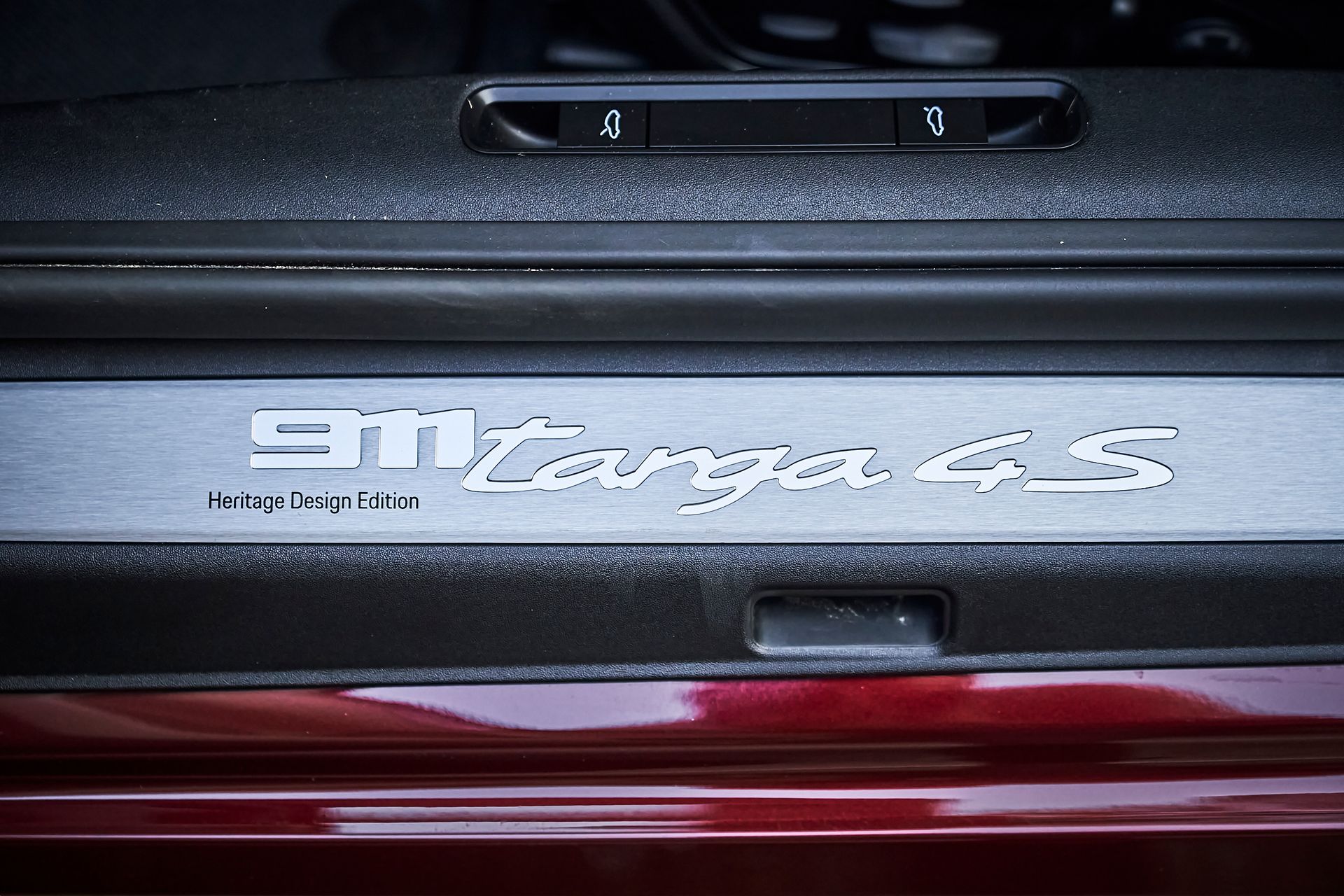 A close up of a porsche 911 targa 4s door sill