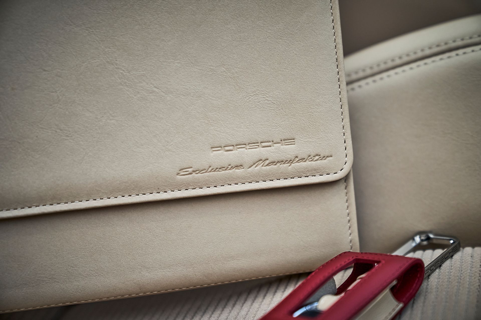 A wallet with the word porsche on it