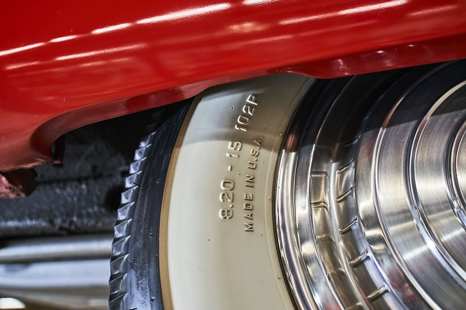 A close up of a tire on a red car