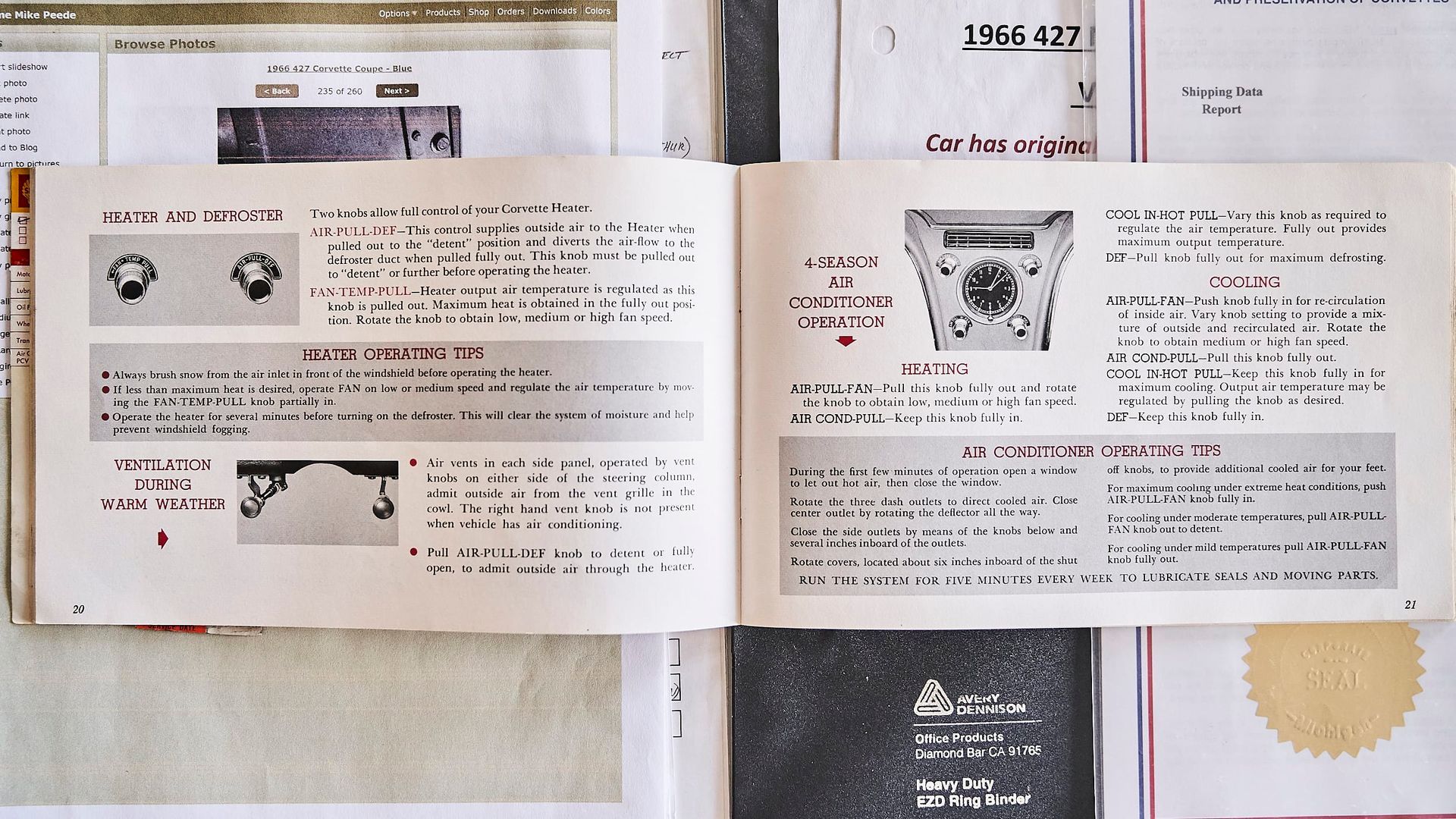 Open book with printed text and diagrams, possibly a manual or guide. Pages are off-white with black text and illustrations.