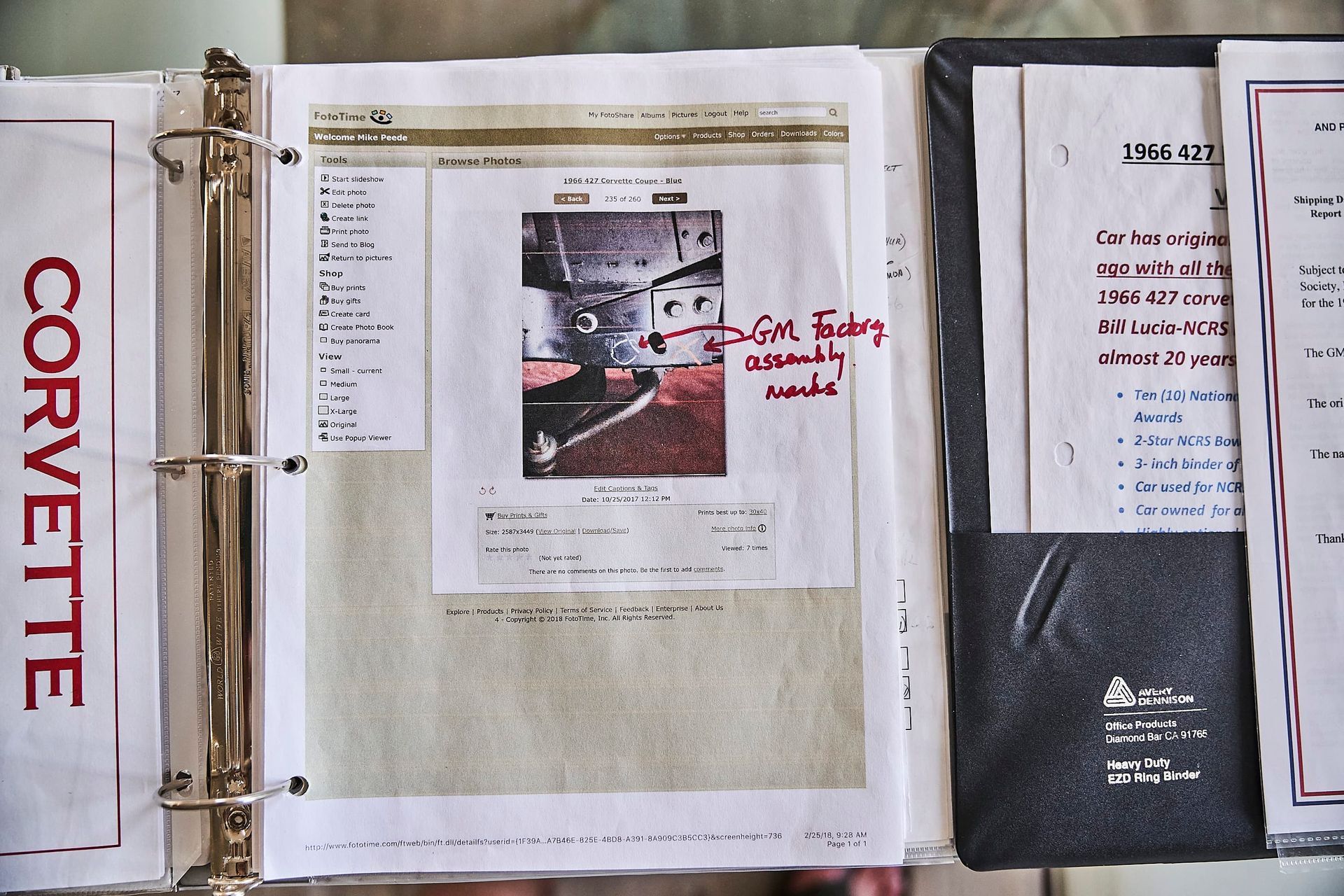Binder open to pages with printed documents and a photo of a Corvette part. Handwritten notes and labels are visible.
