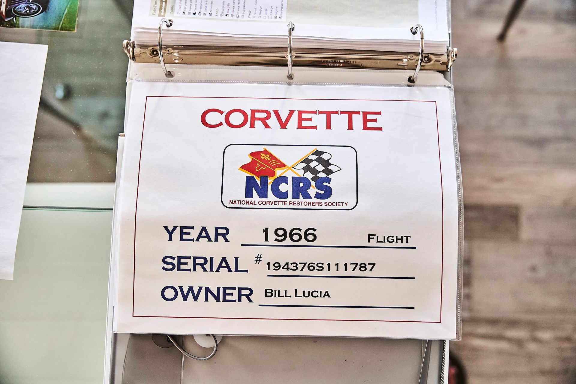 Sign for a 1966 Corvette, showing the year, serial number, and owner's name; logo for the National Corvette Restorers Society.