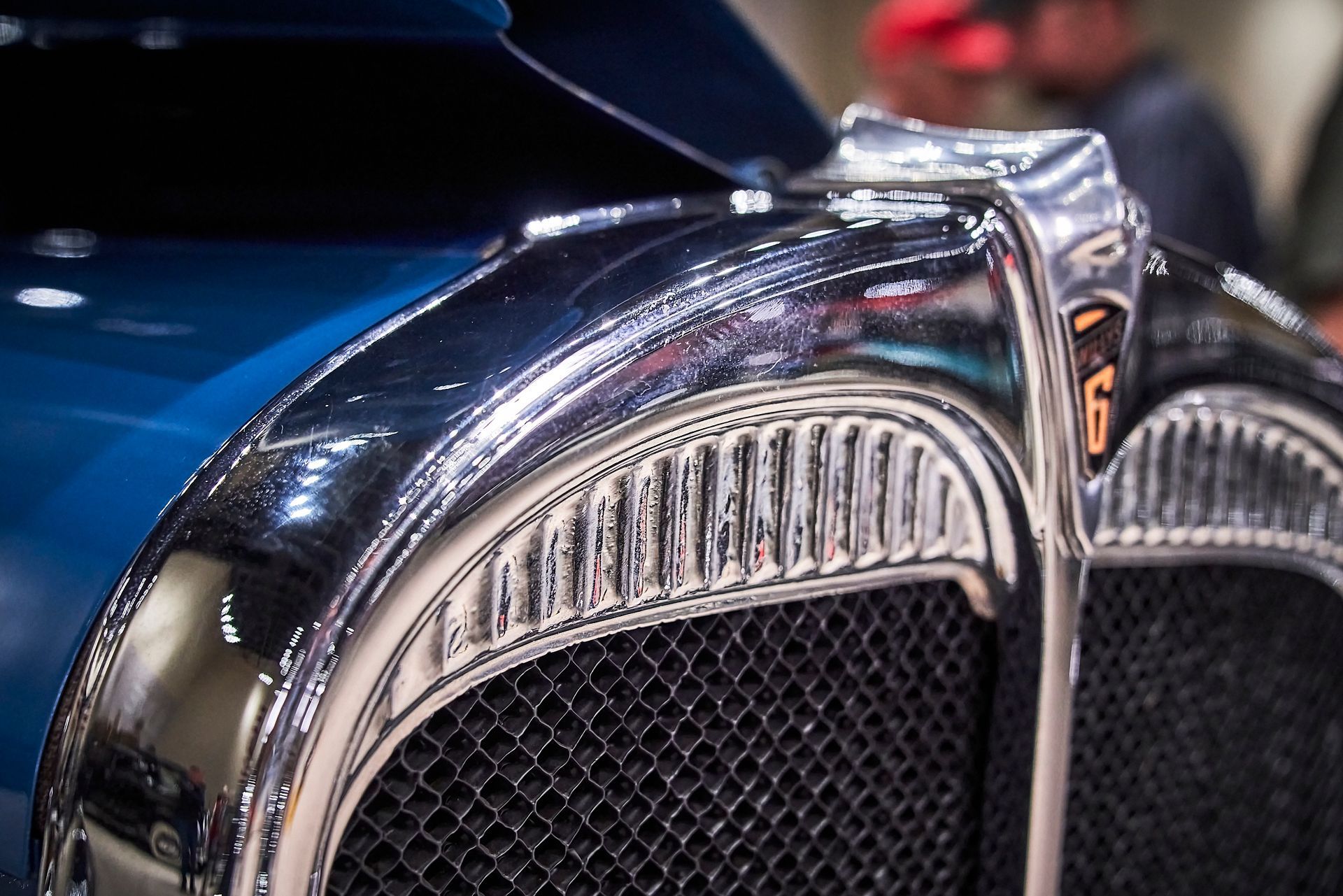 A close up of the front of an old car with the number 6 on it