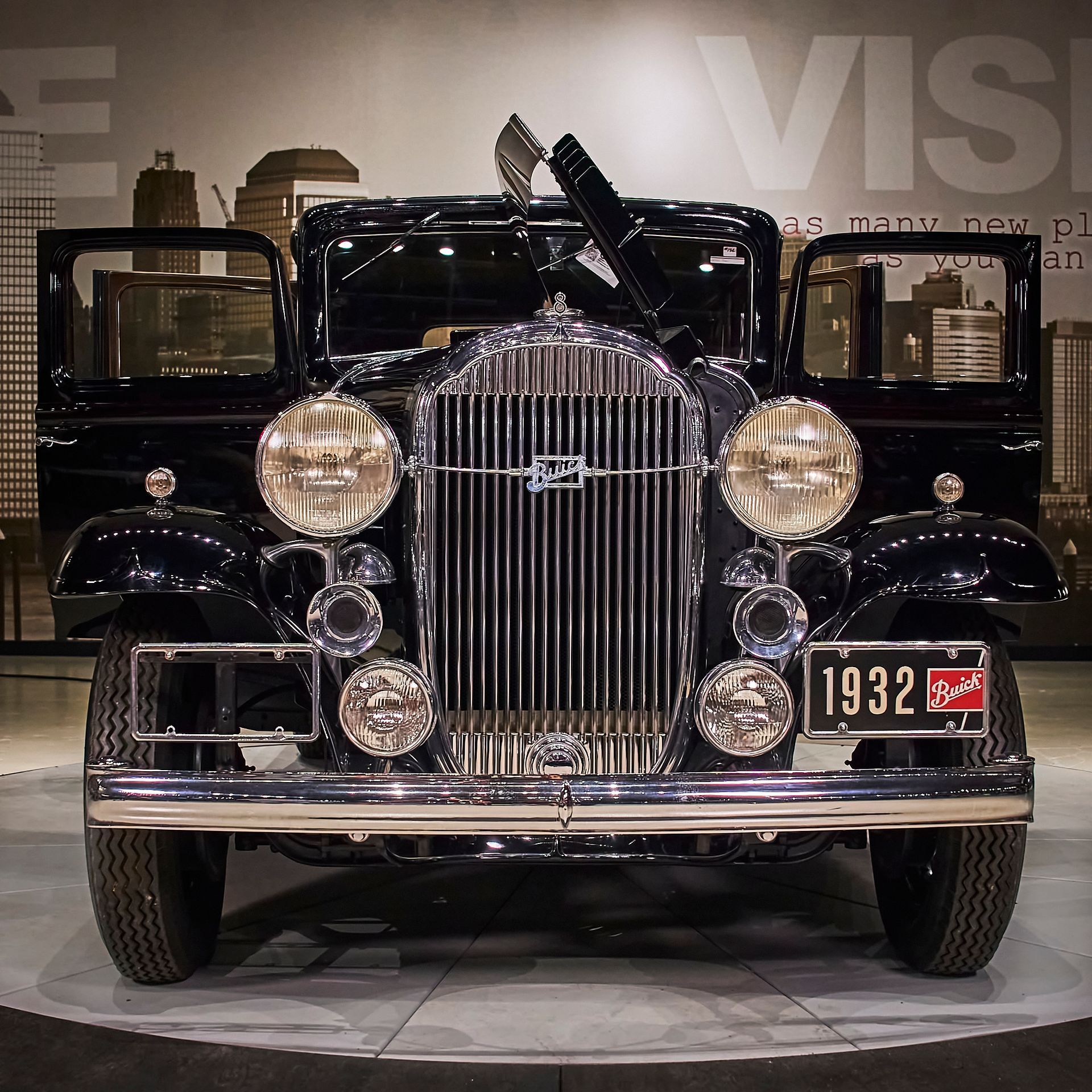 A black car with a license plate that says 1932