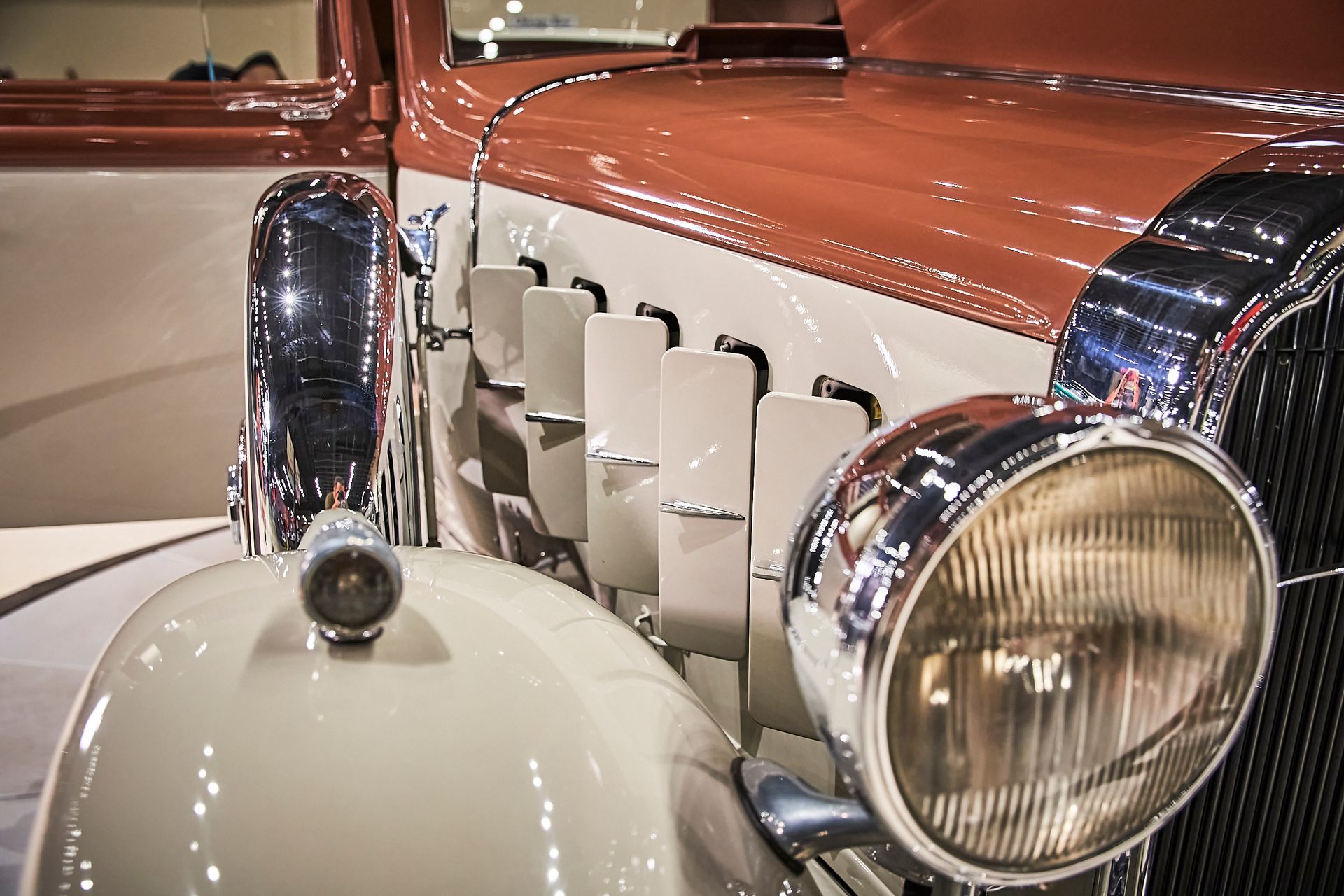 A close up of the front of an old car