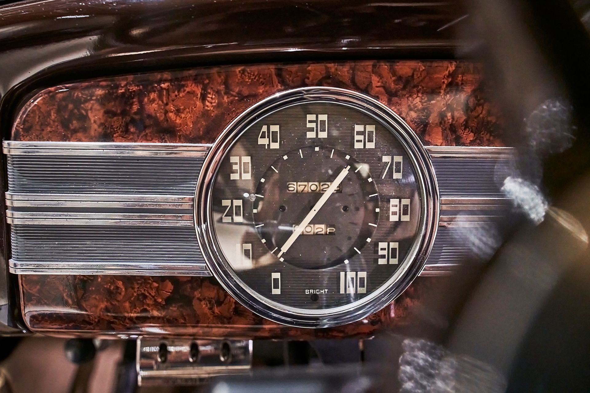 A close up of a speedometer in a car