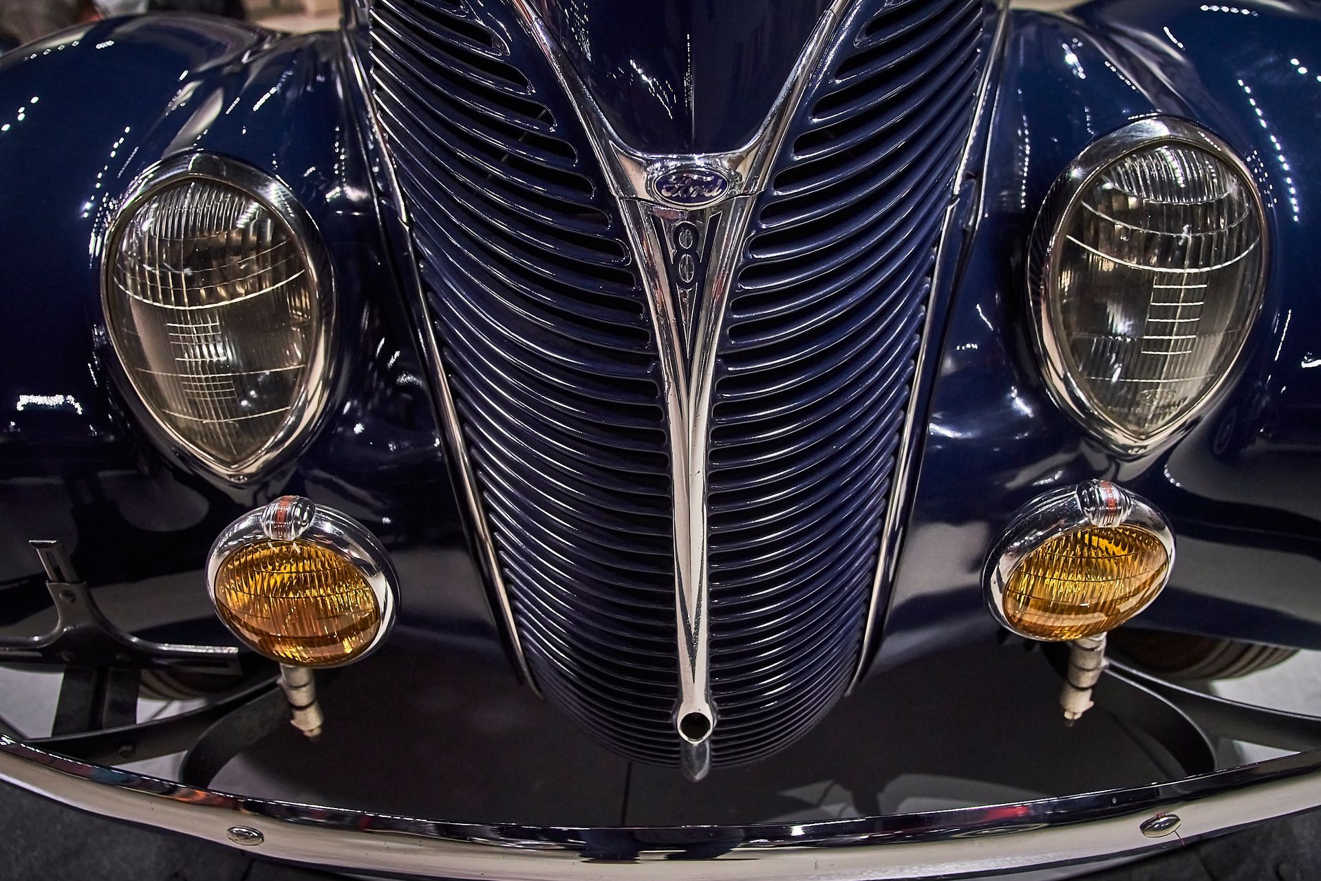 A close up of the front of a blue car