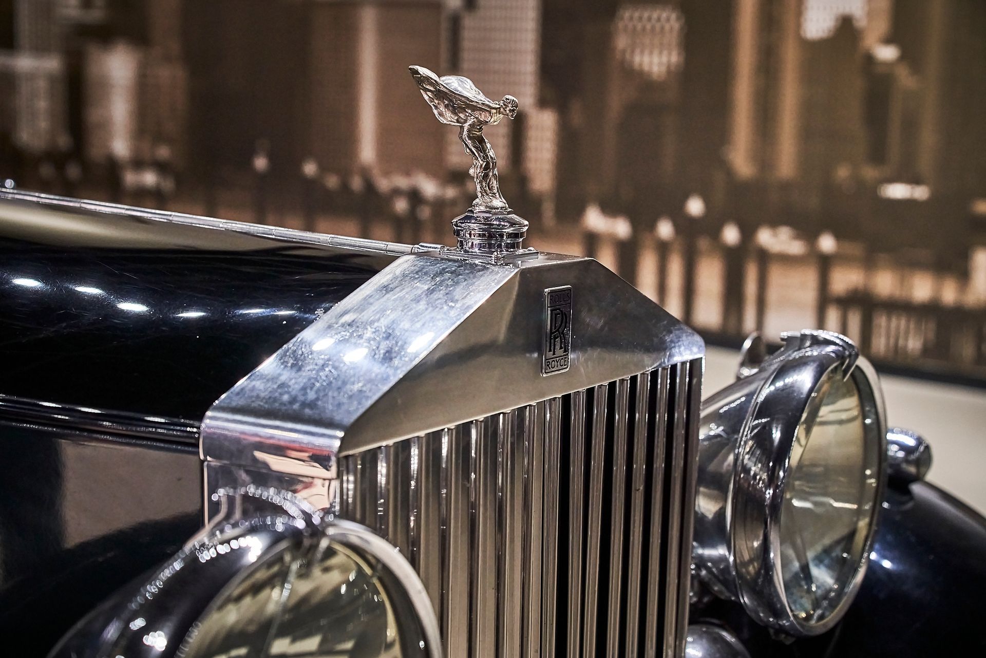 A close up of the front of a rolls royce car