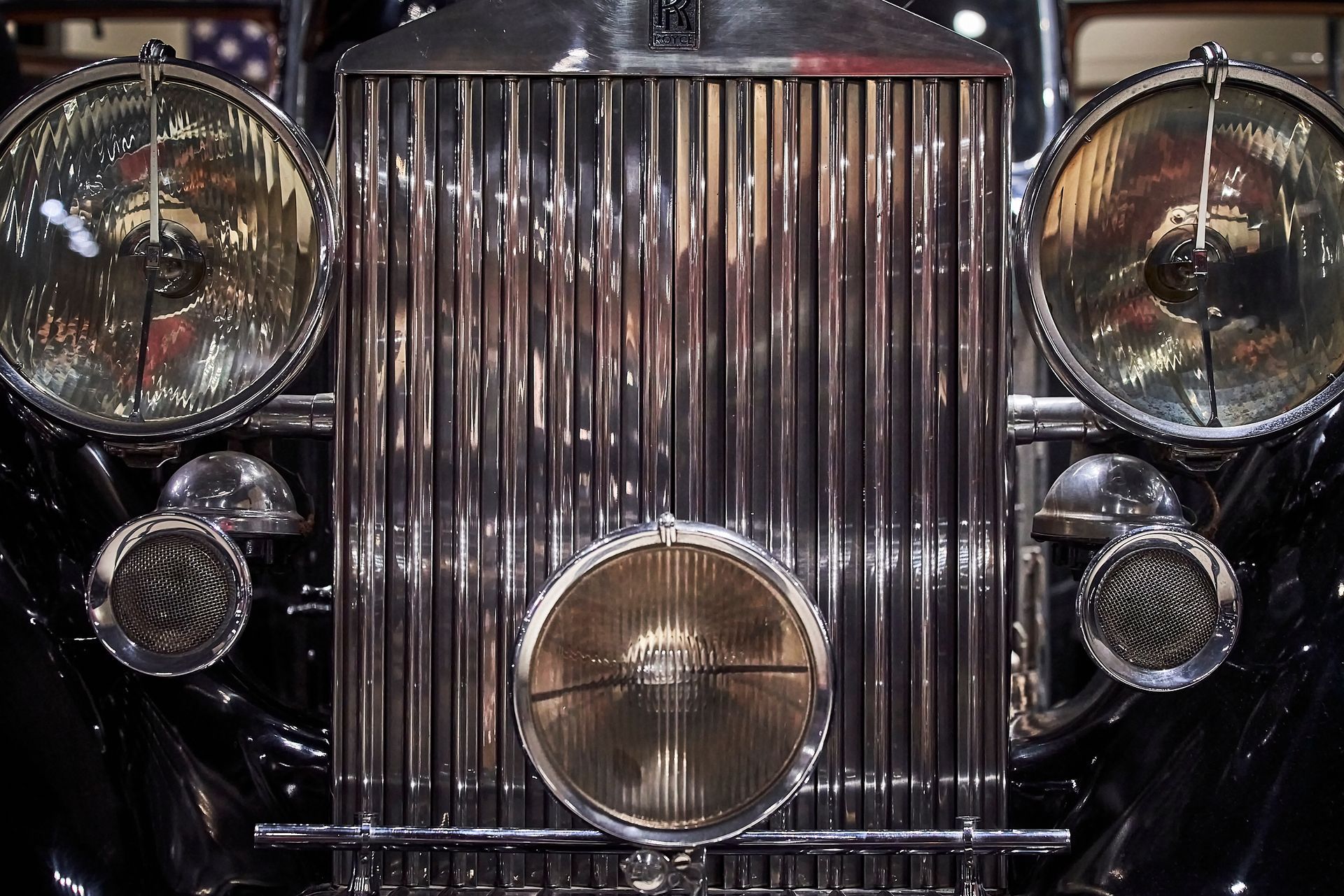 A close up of the front of a rolls royce car