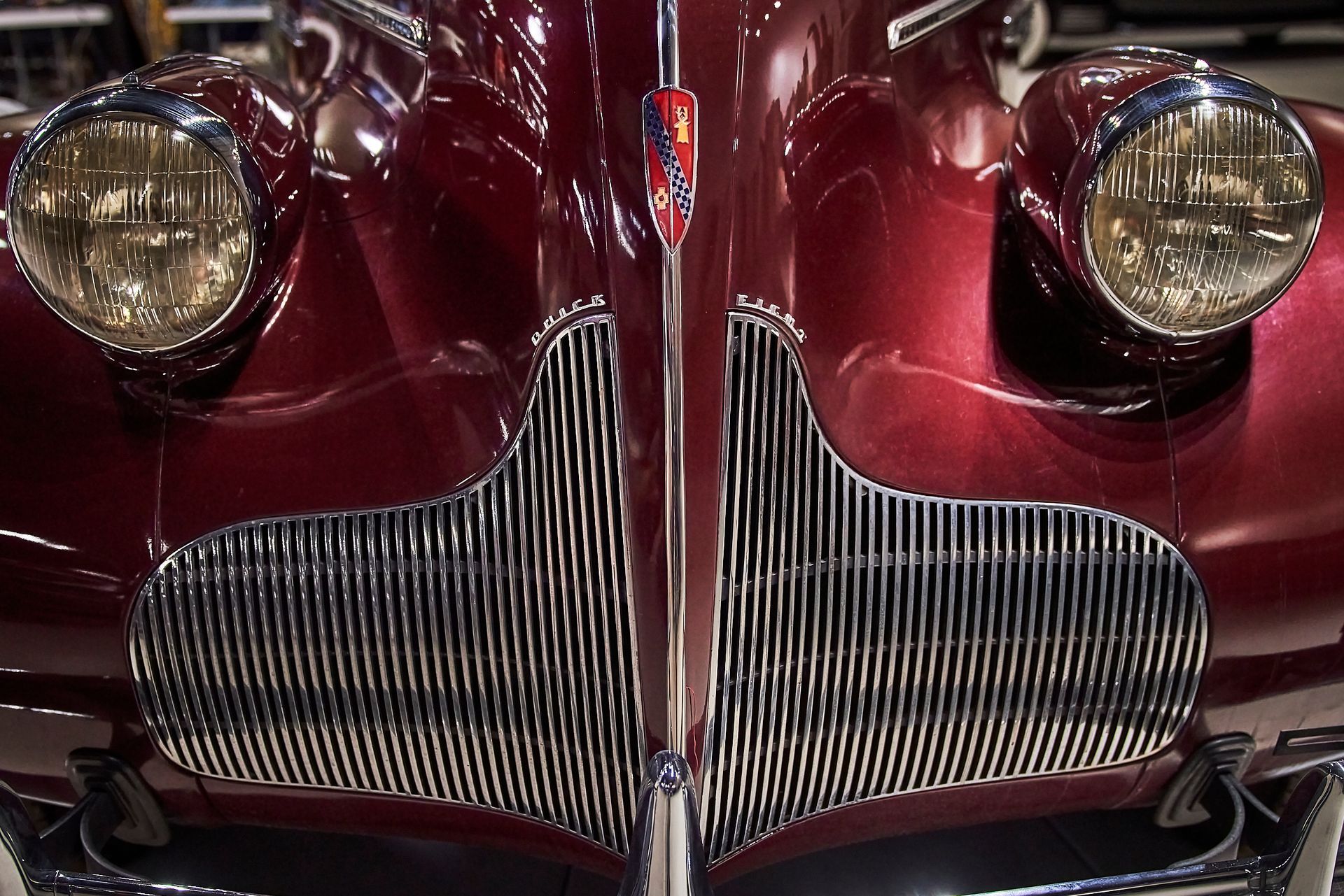A close up of the front of a red car