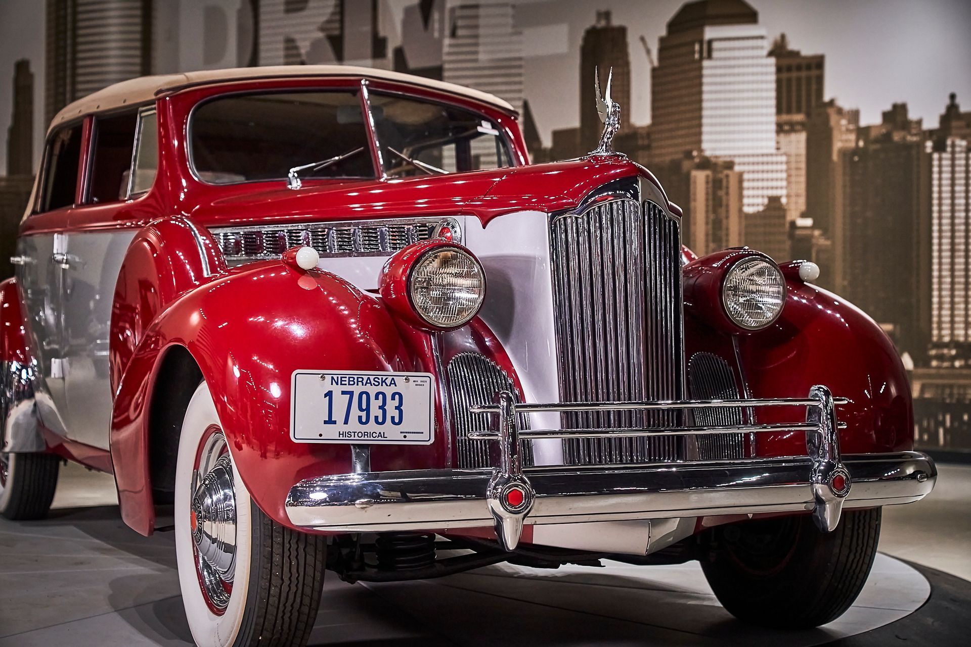 A red car with a license plate that says 17933