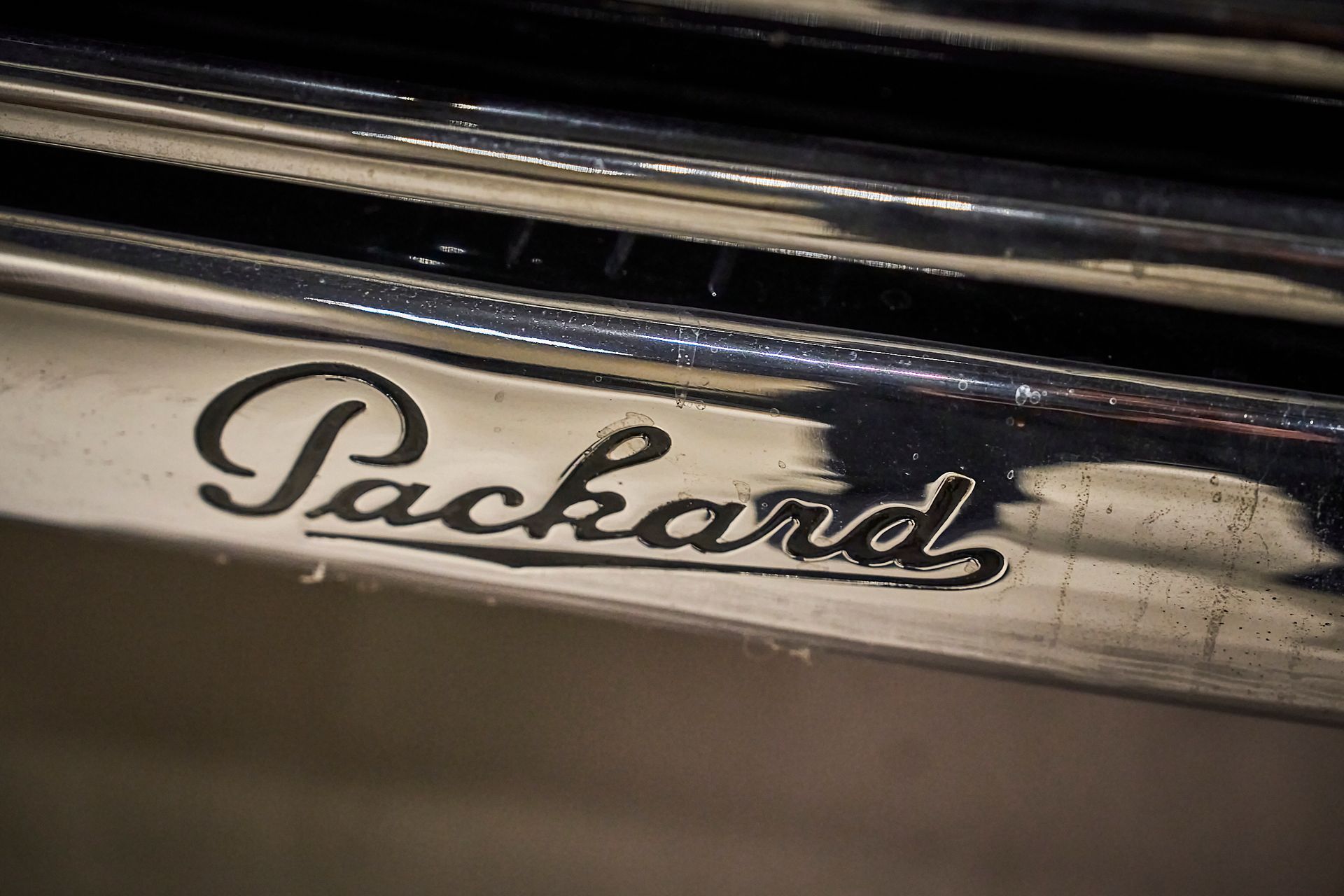 A close up of a car grille with the word packard on it