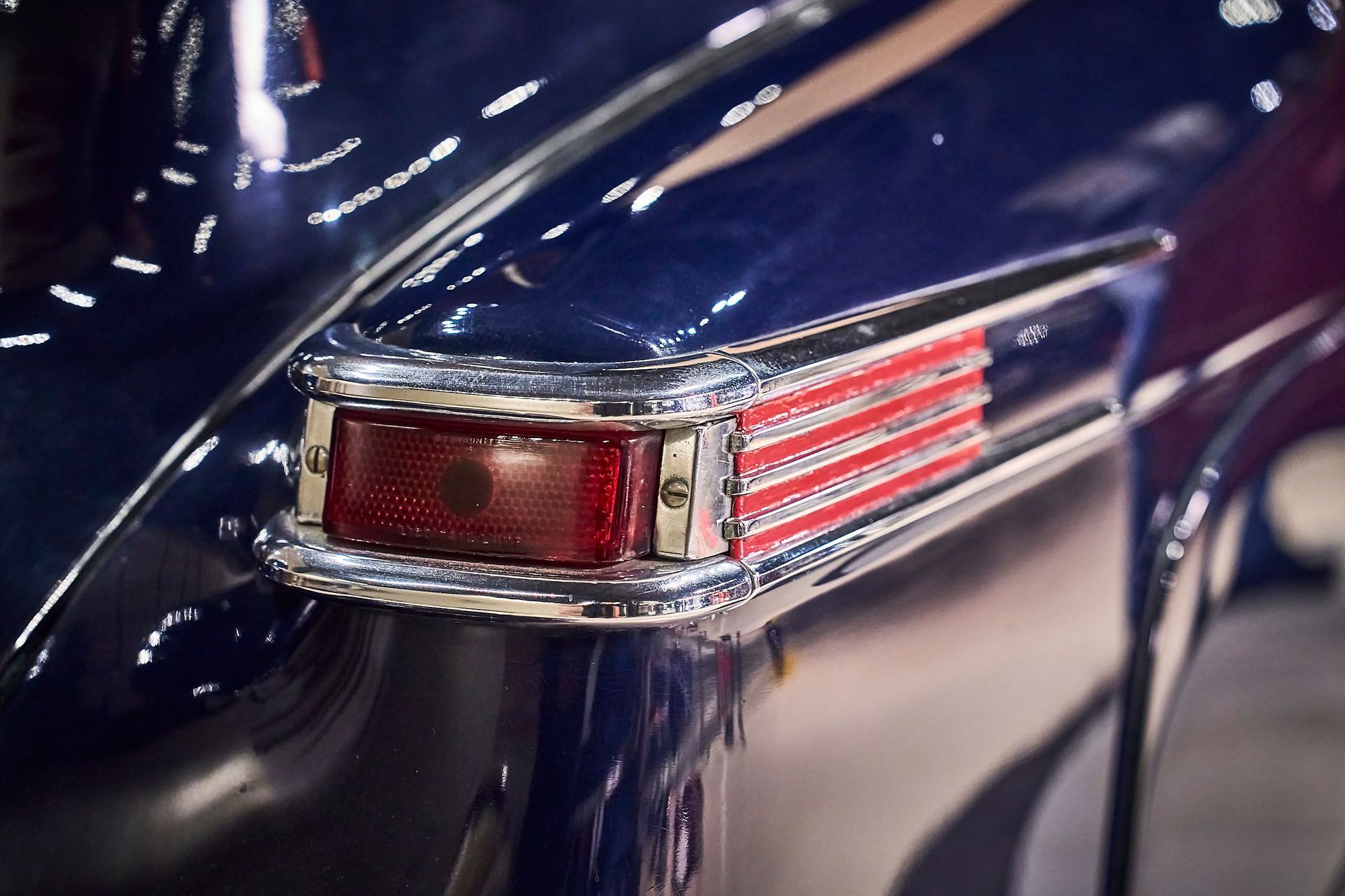 A close up of a blue car 's tail light