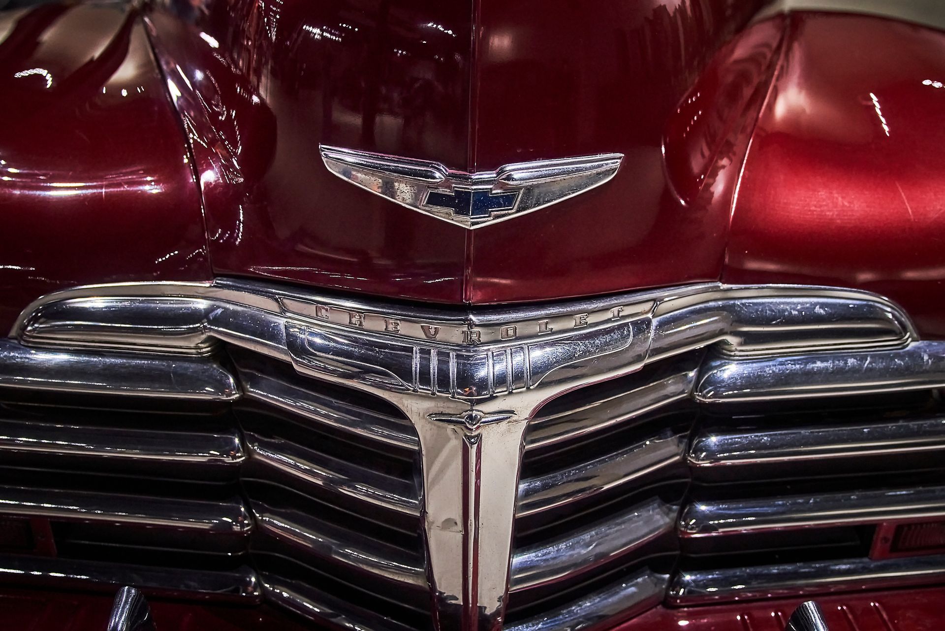 A close up of the front of a red car