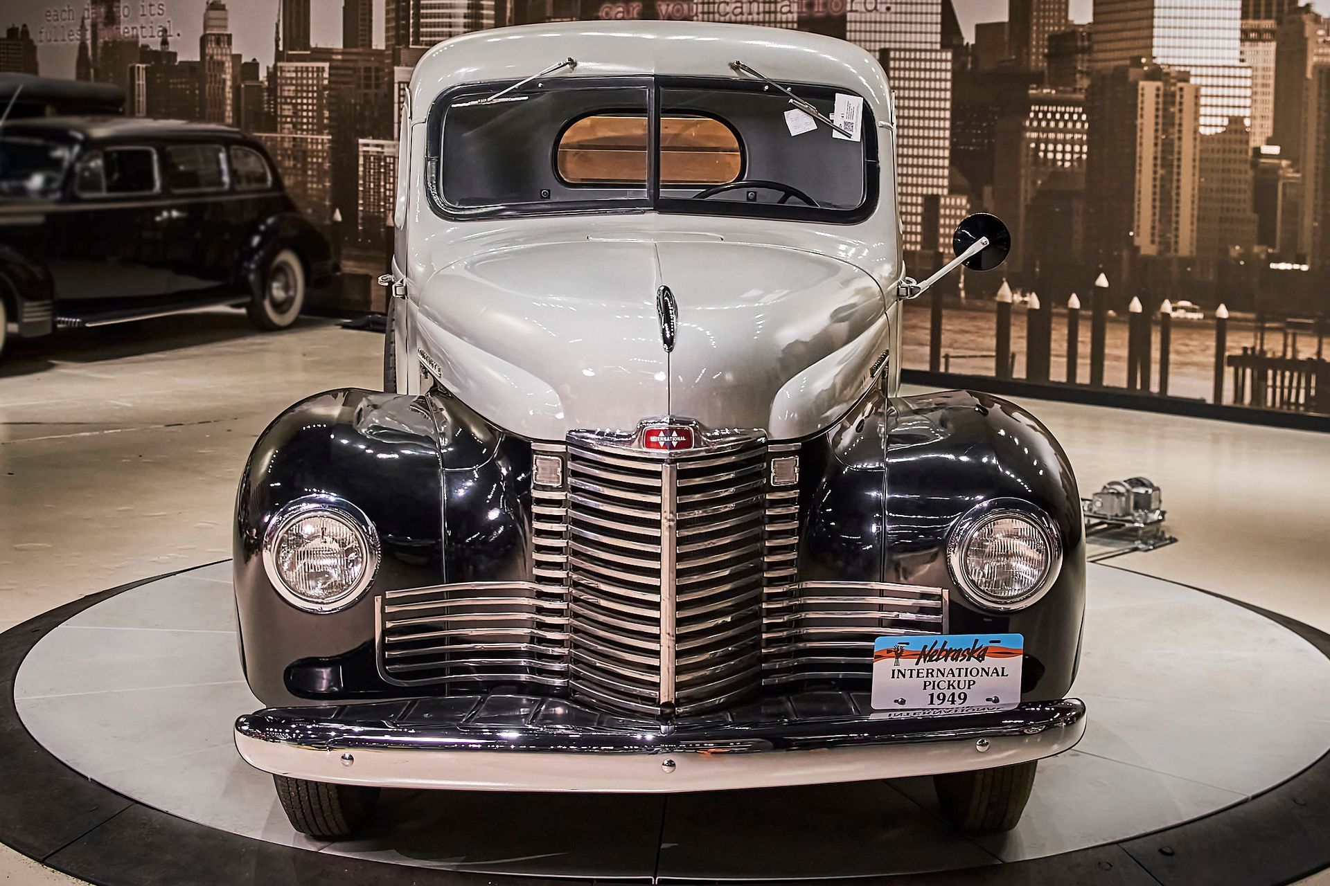A black and white car with a new york license plate