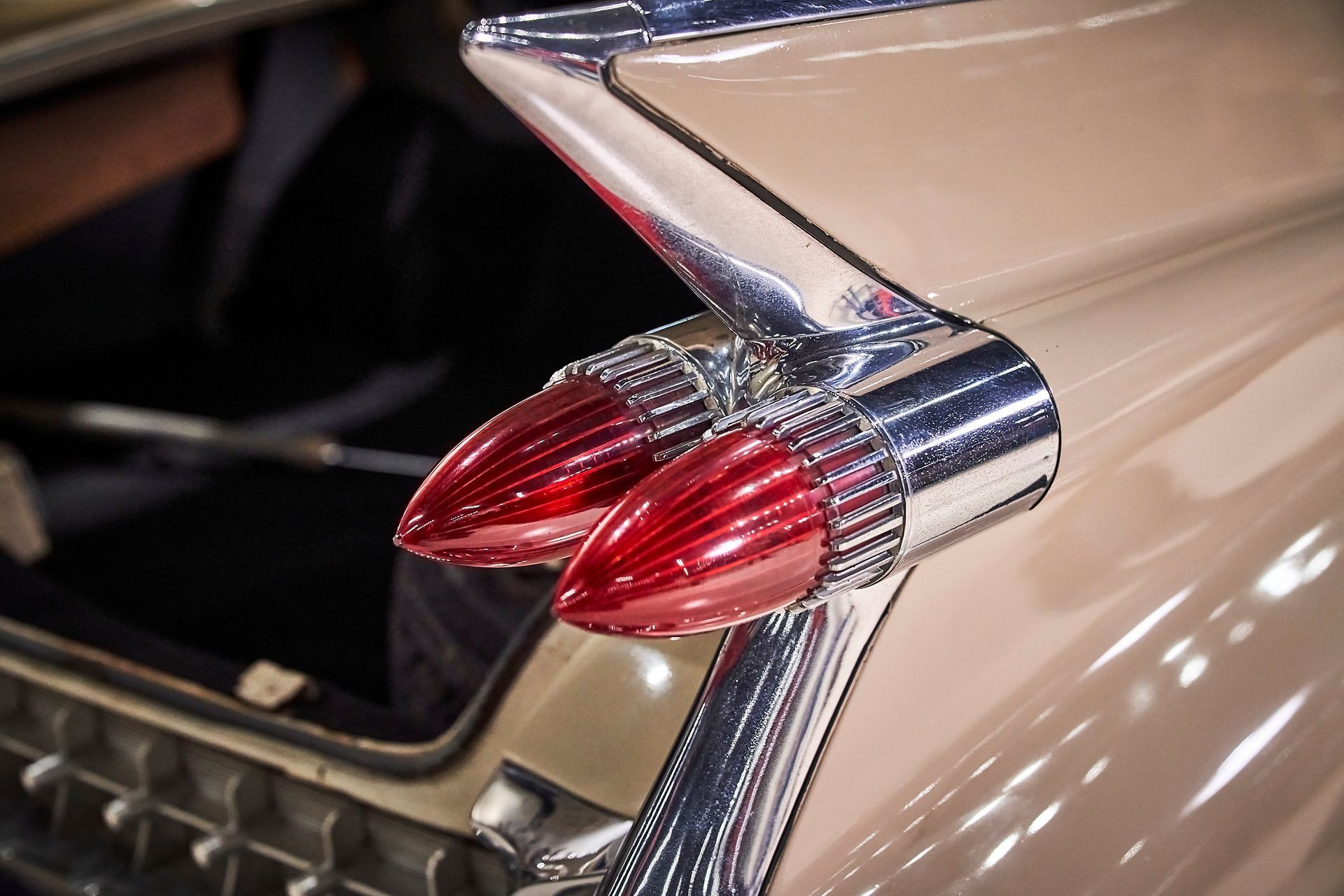 A close up of the tail lights of an old car.