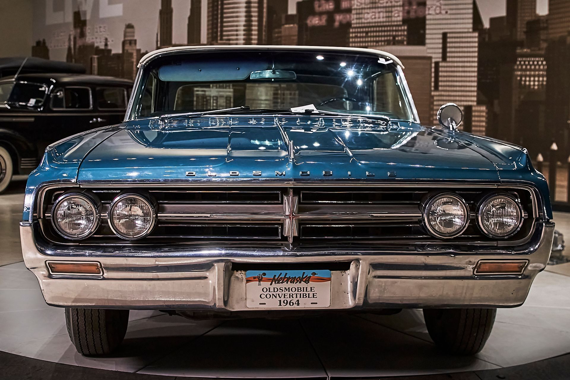 A blue car with a new york license plate
