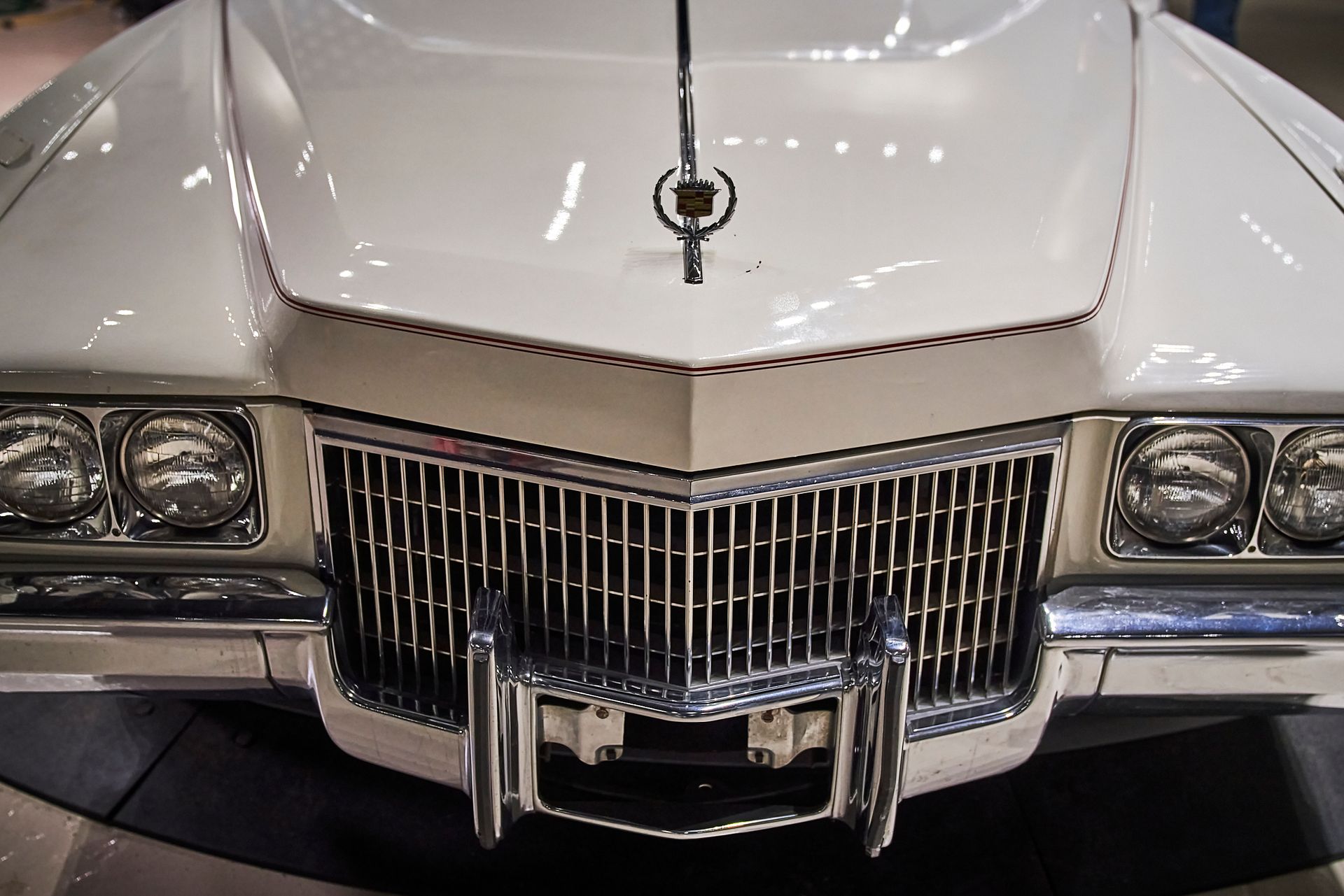 A white car with a key on the hood
