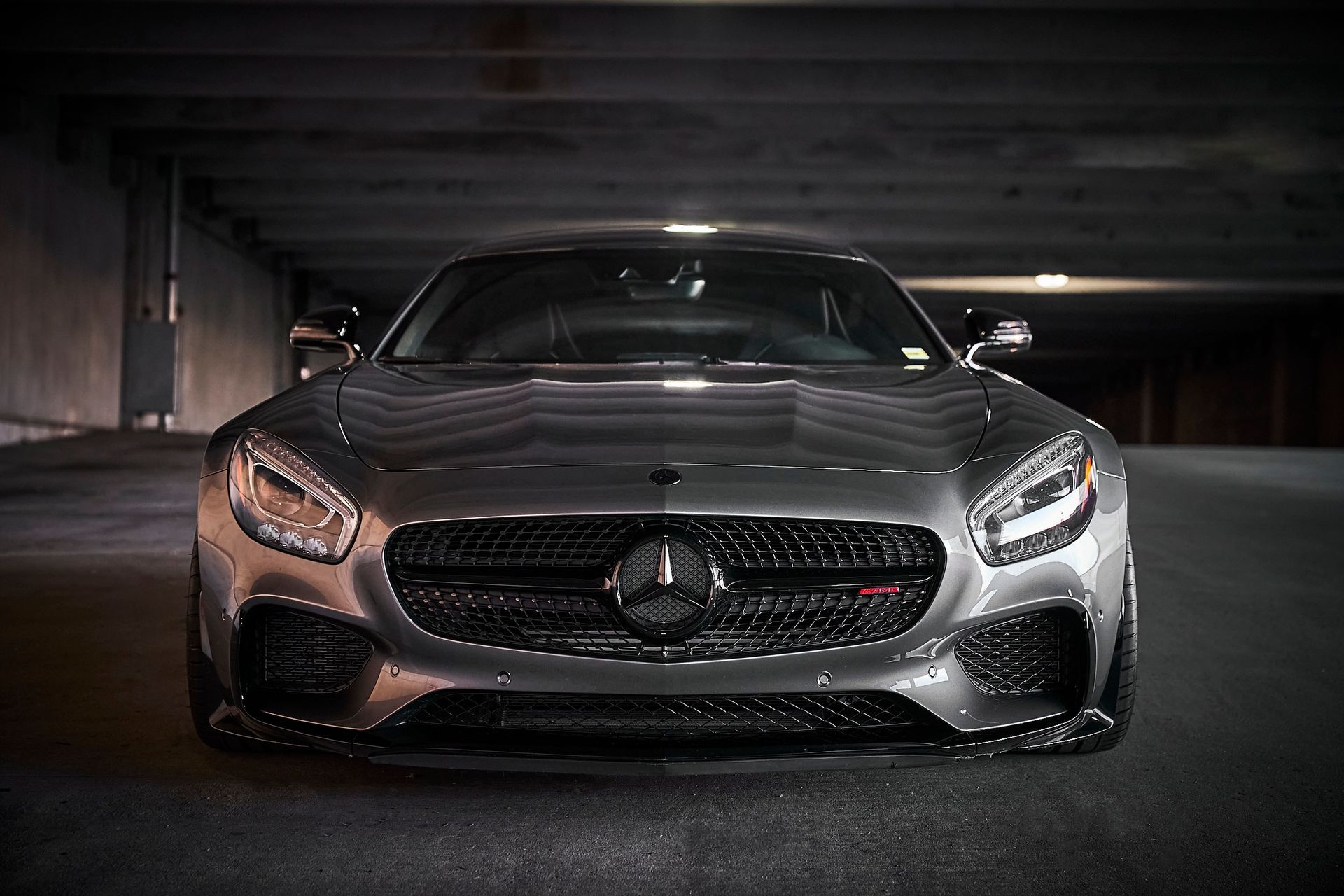 A mercedes benz sl63 amg is parked in a parking garage.
