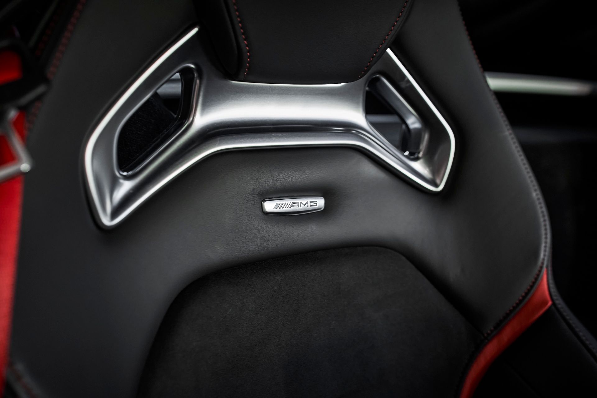 A close up of a car seat with a logo on it.