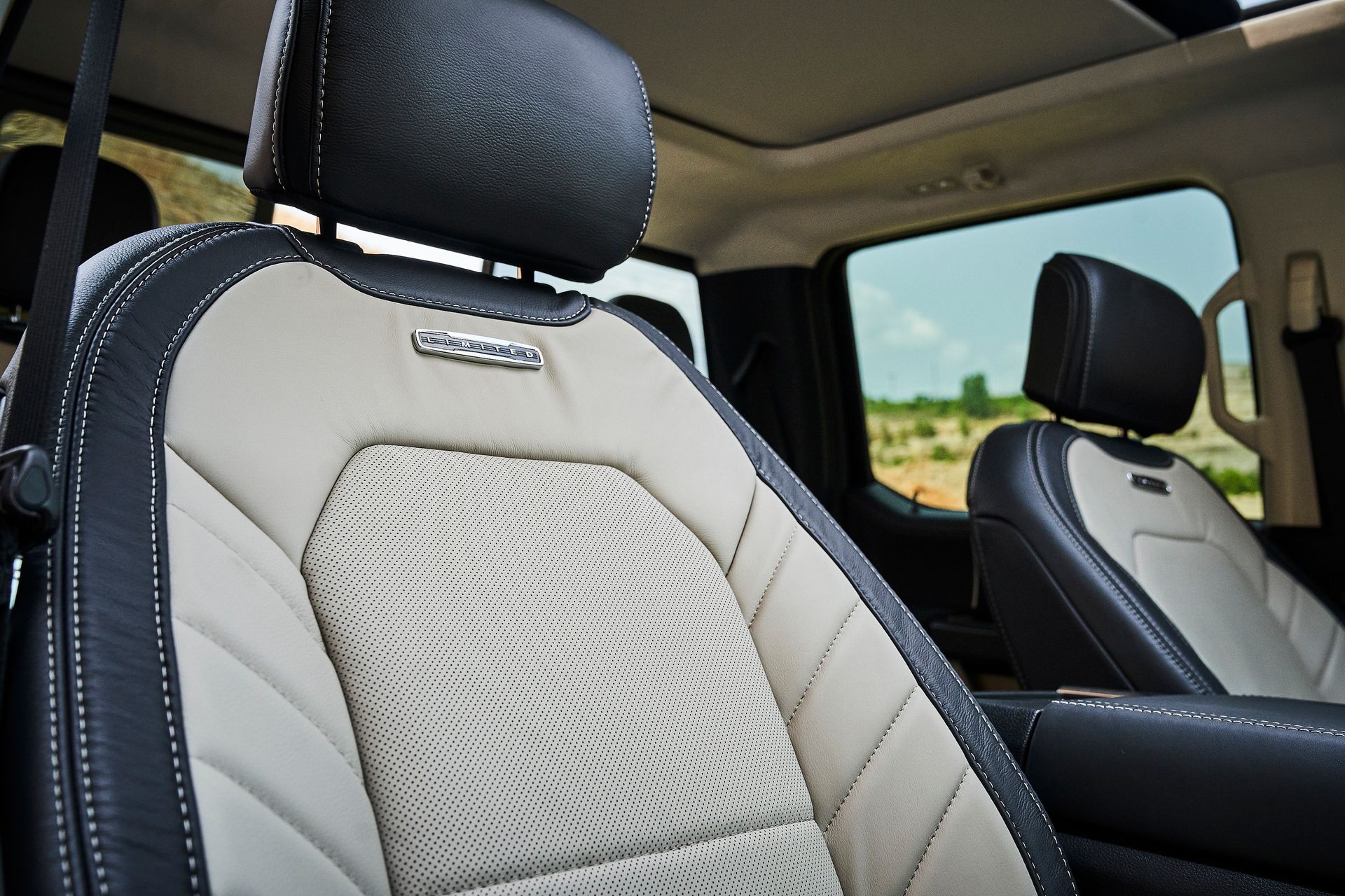 A close up of a car seat with the word ford on it