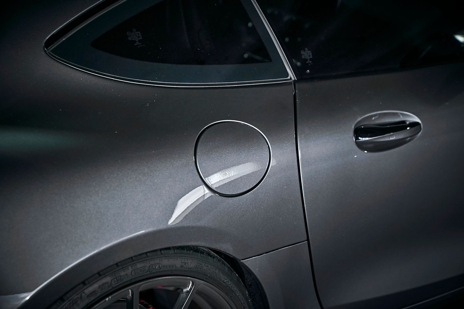 A close up of a car with a gas cap on the side
