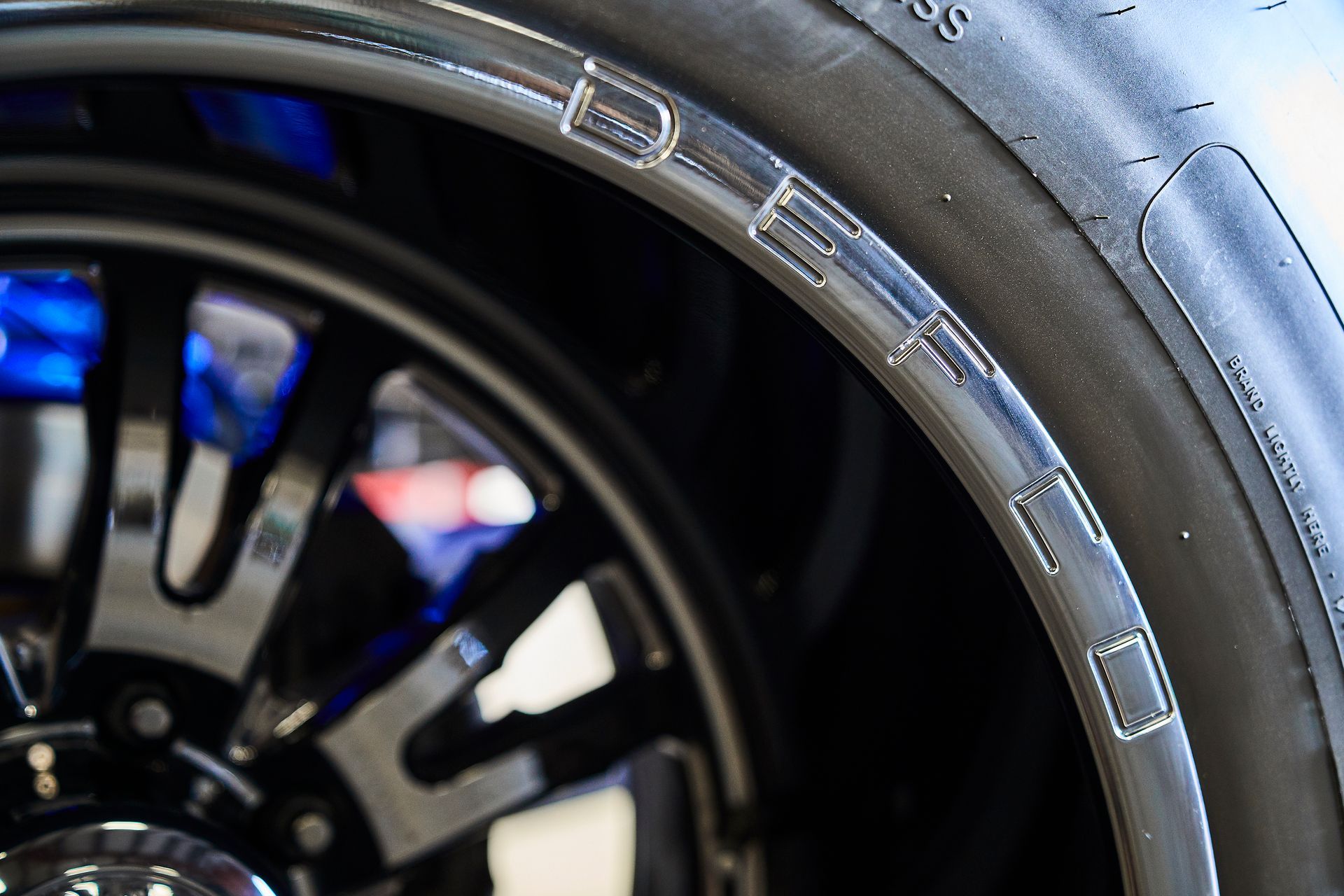 A close up of a tire on a car wheel.