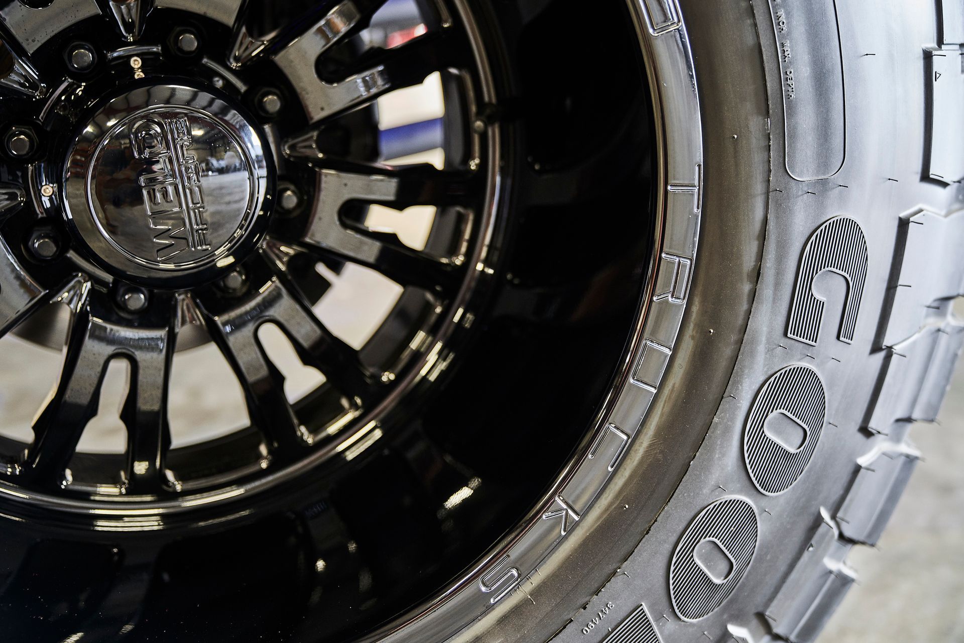 A close up of a tire and rim on a car