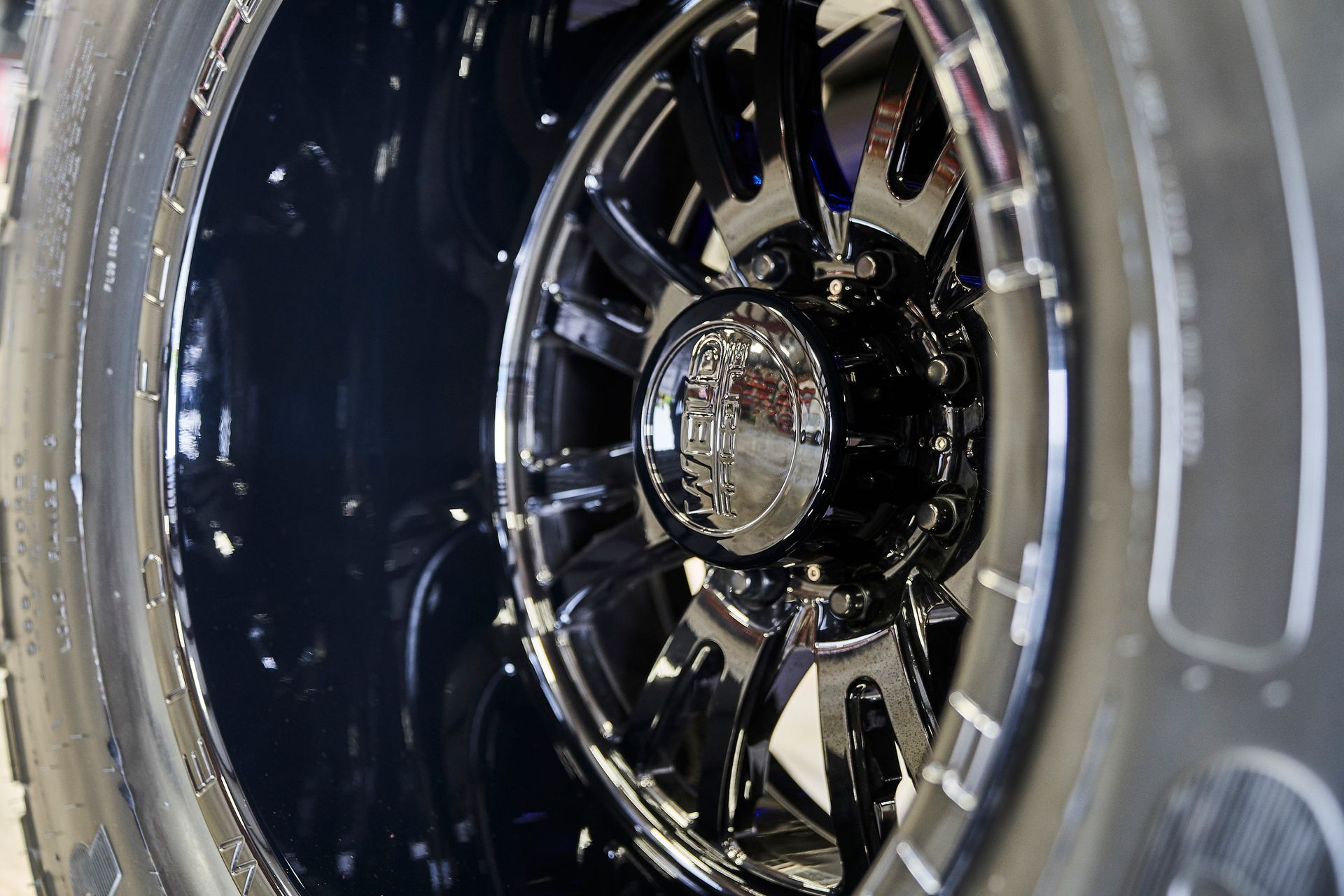 A close up of a tire and wheel on a car.