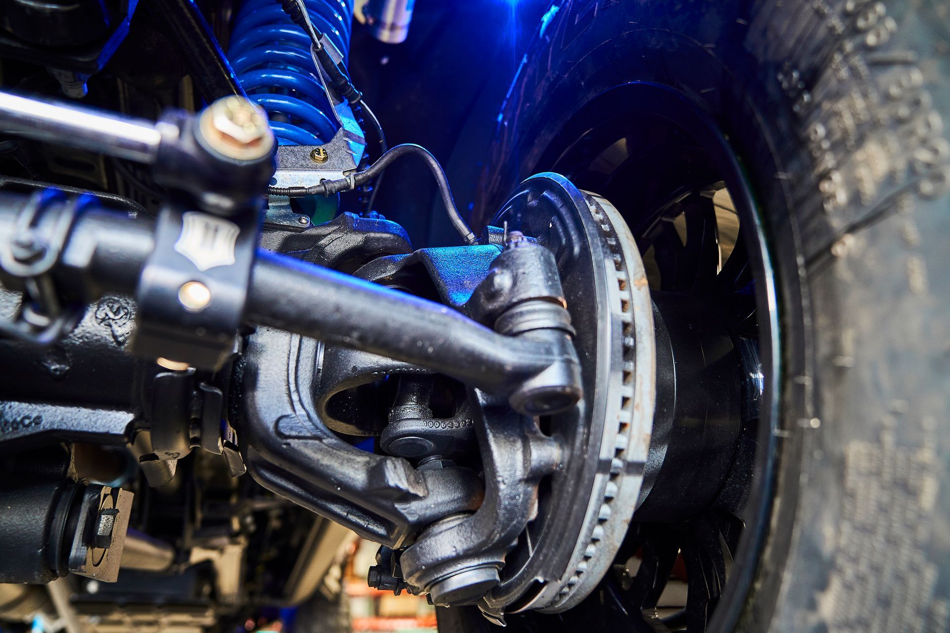 A close up of the front suspension of a truck.