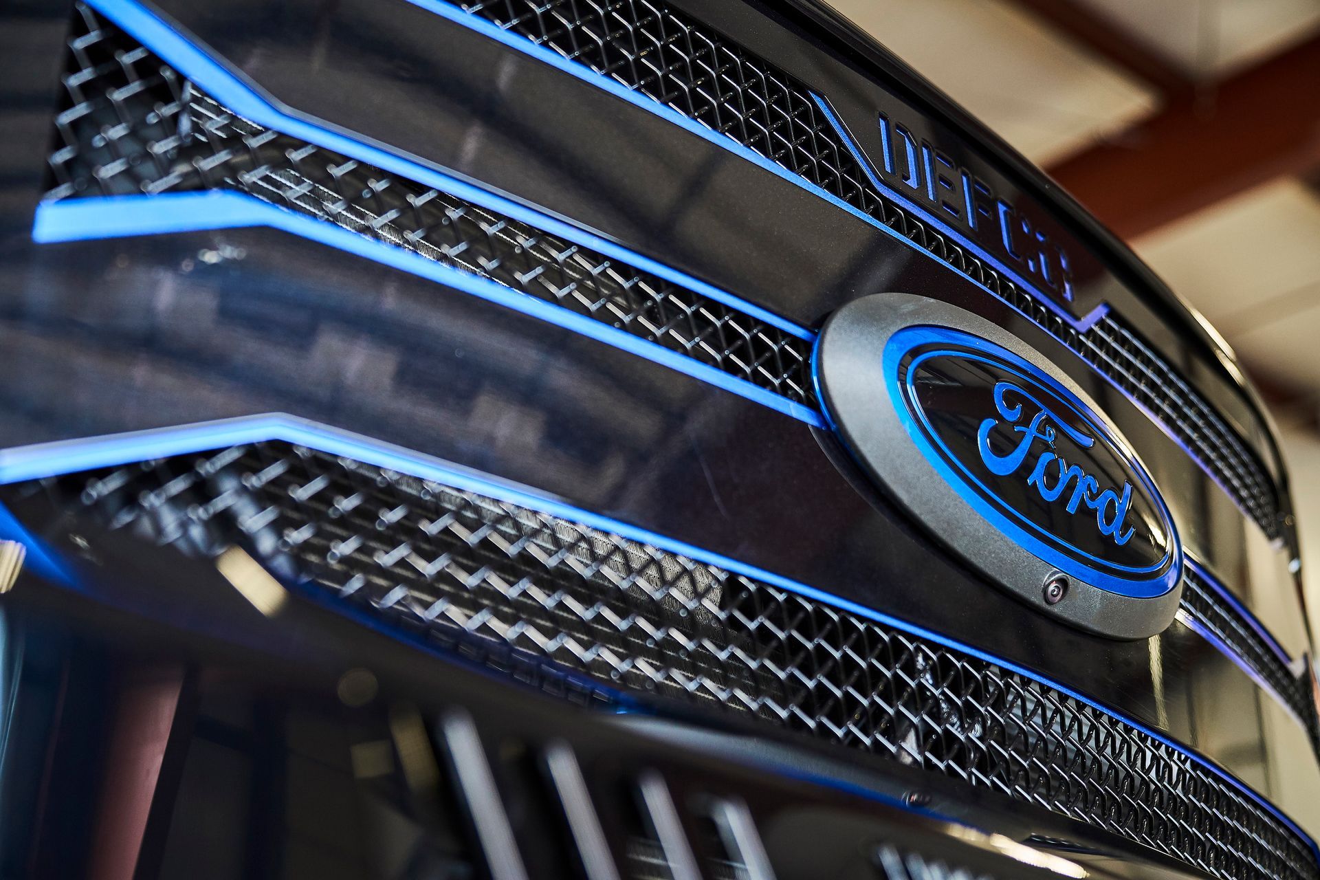 A close up of the front grille of a ford truck