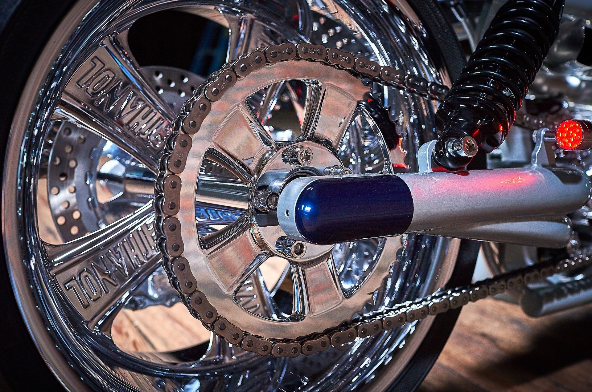A close up of the rear wheel of a motorcycle