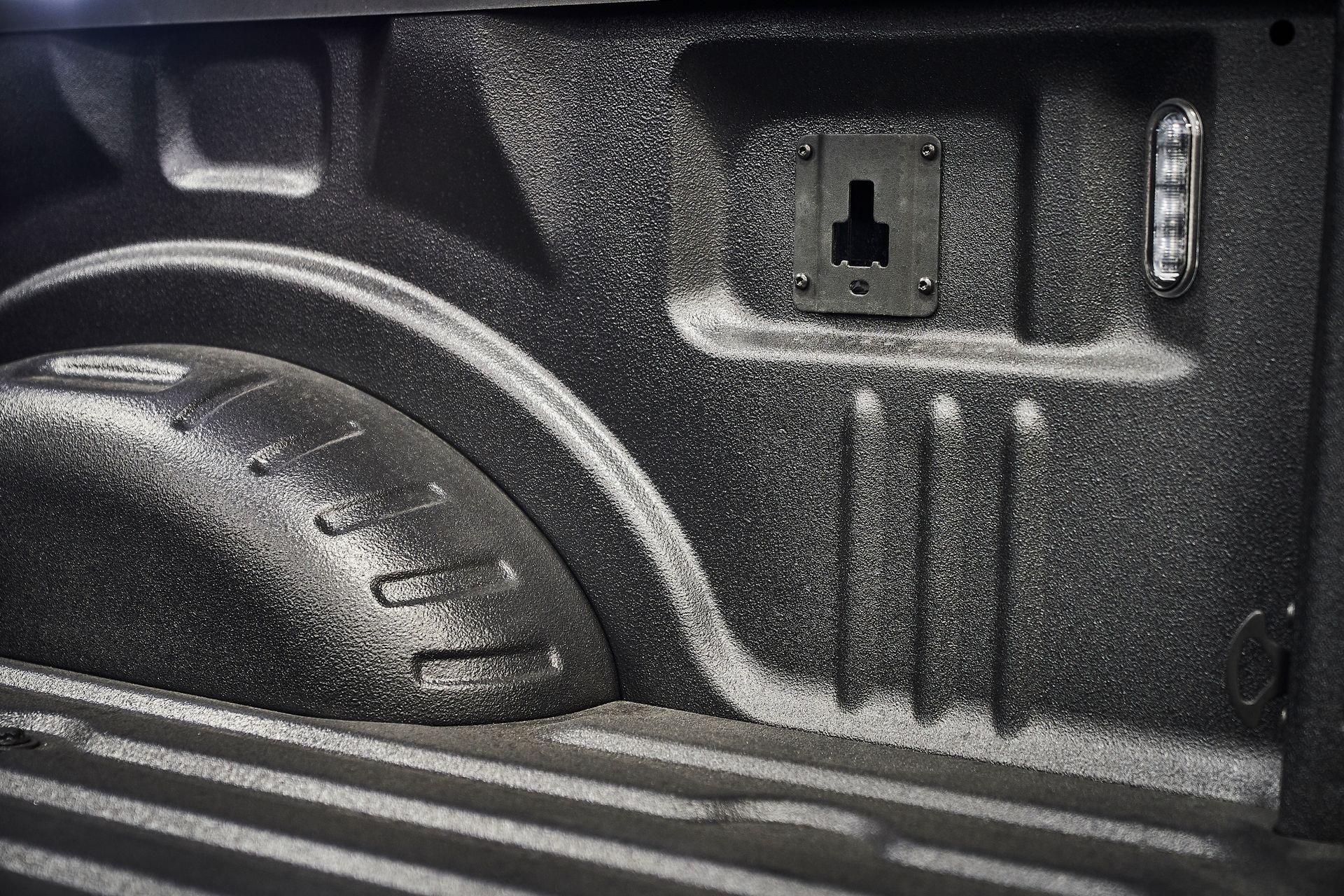 A black and white photo of the back of a truck.