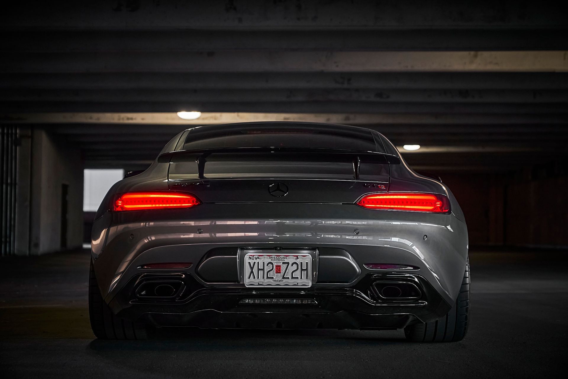 A mercedes benz amg gt is parked in a parking garage.