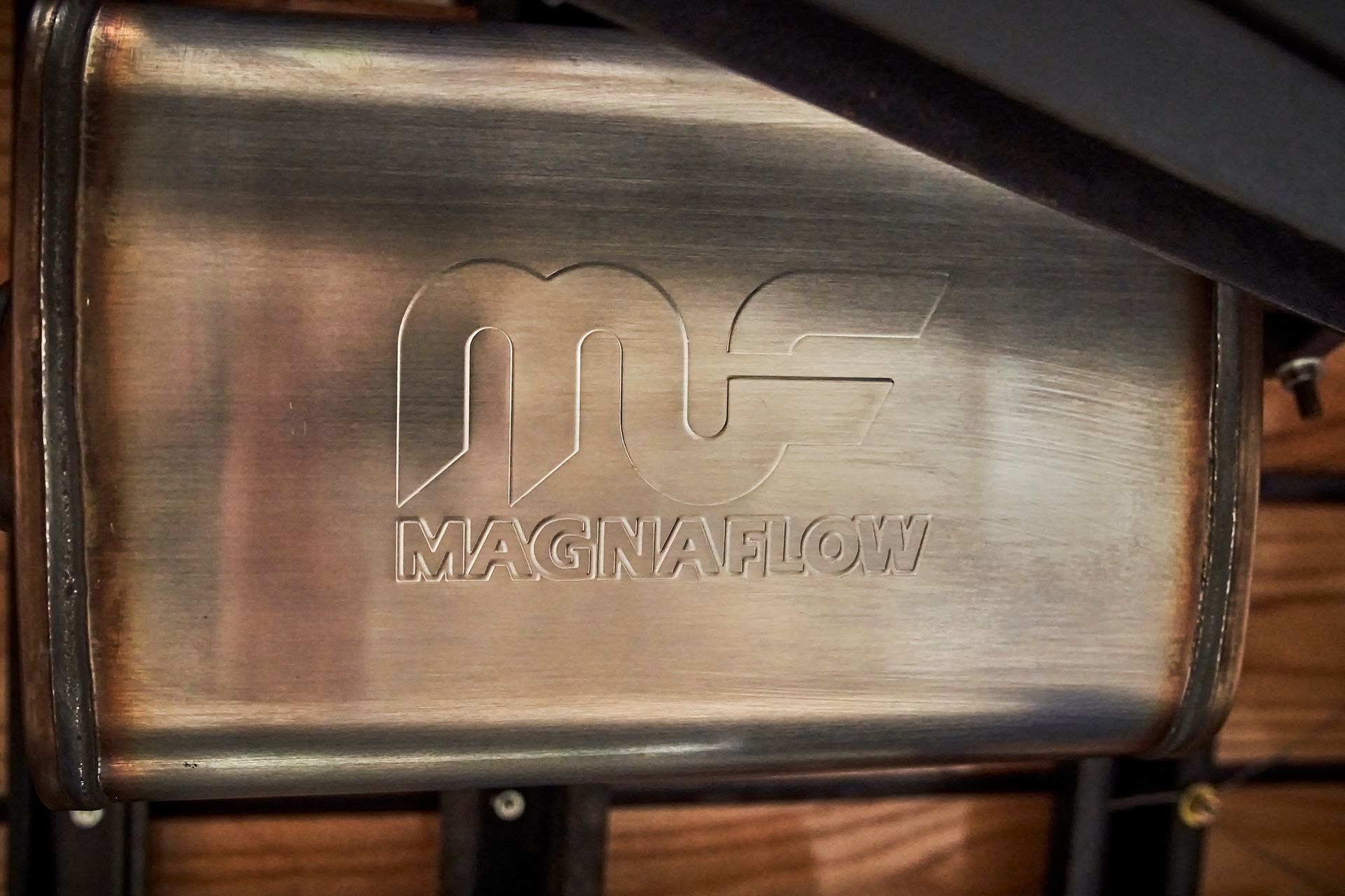 A close up of a metal object with the word magnaflow on it.