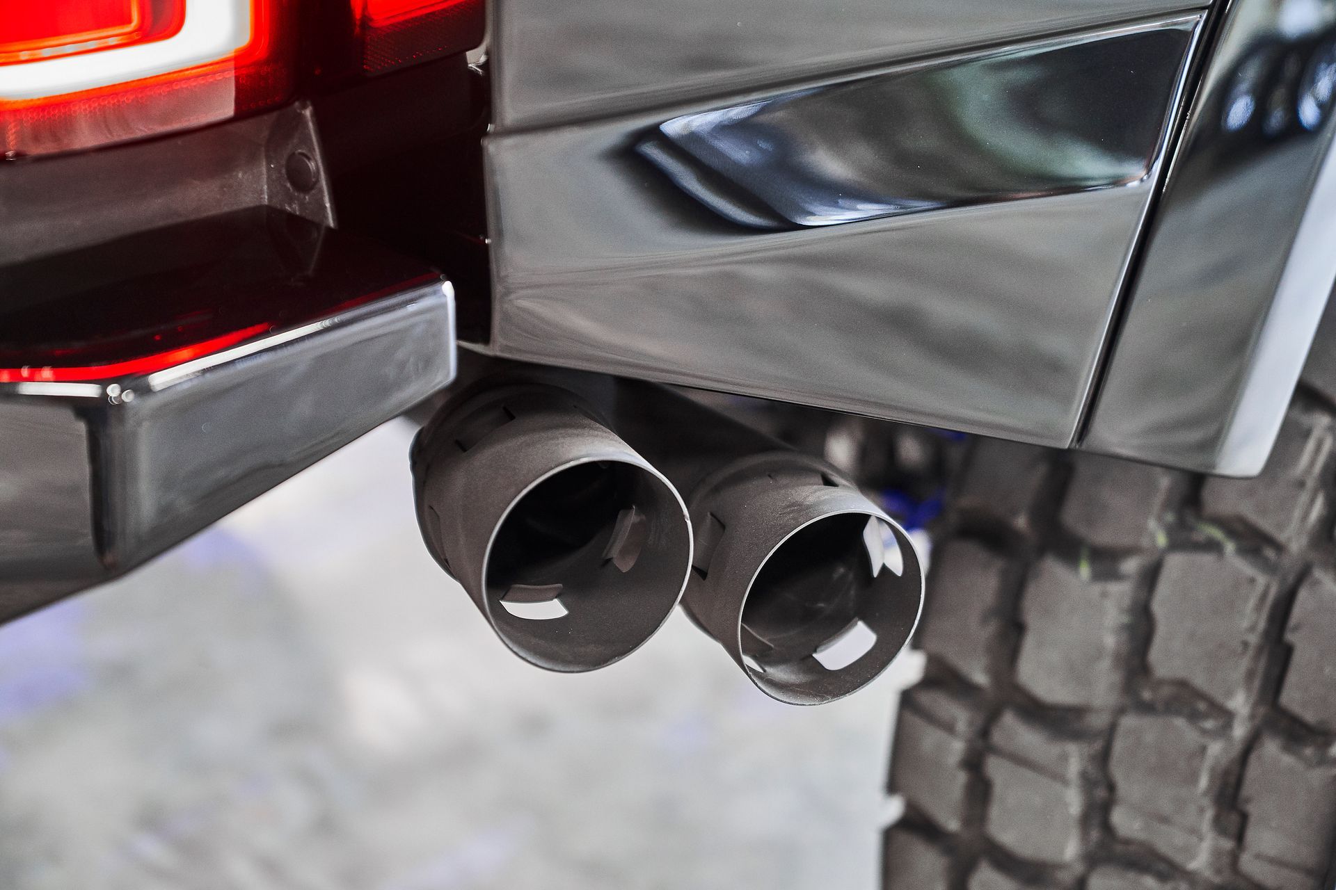A close up of the exhaust pipes of a truck.