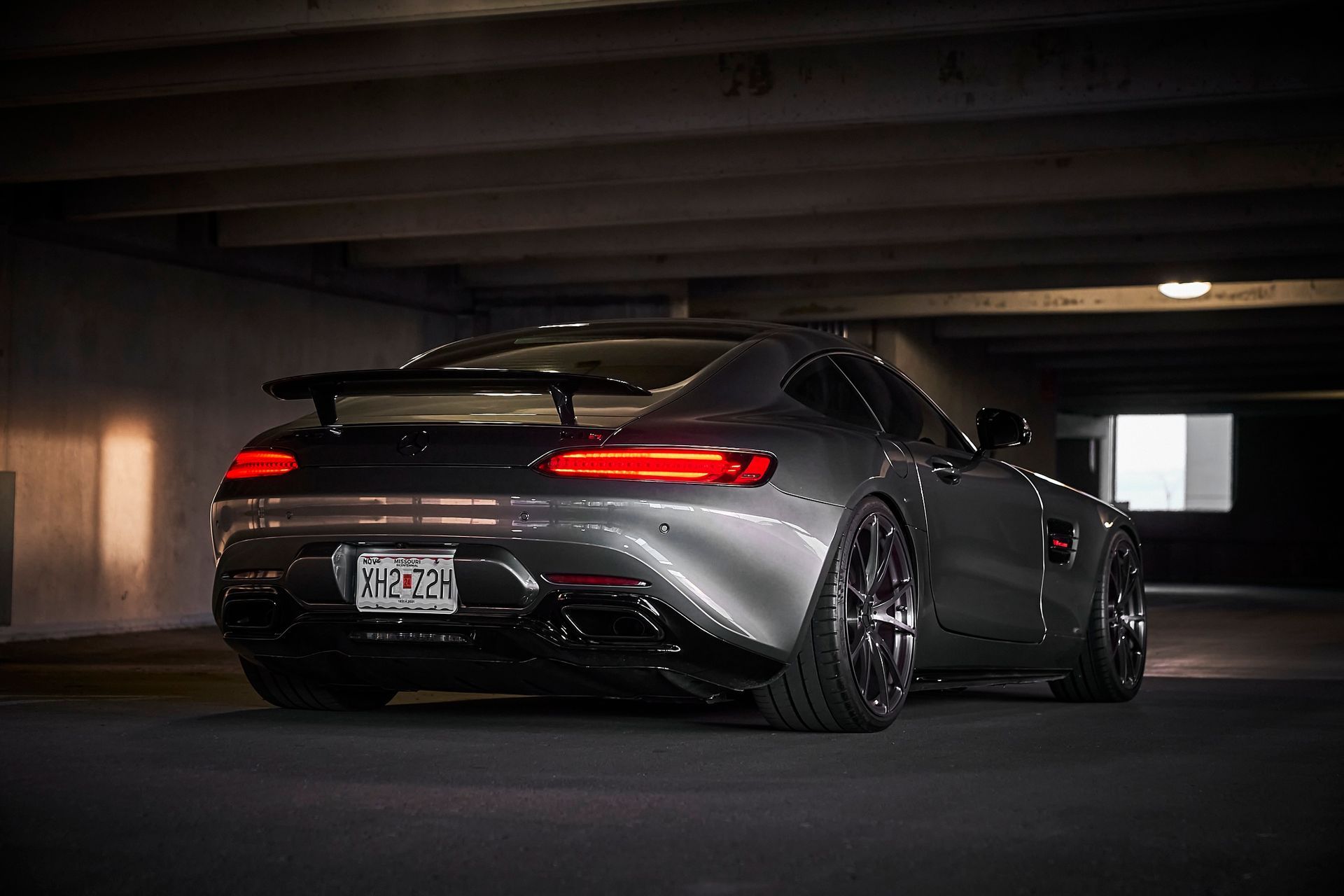 A mercedes amg gt is parked in a parking garage.