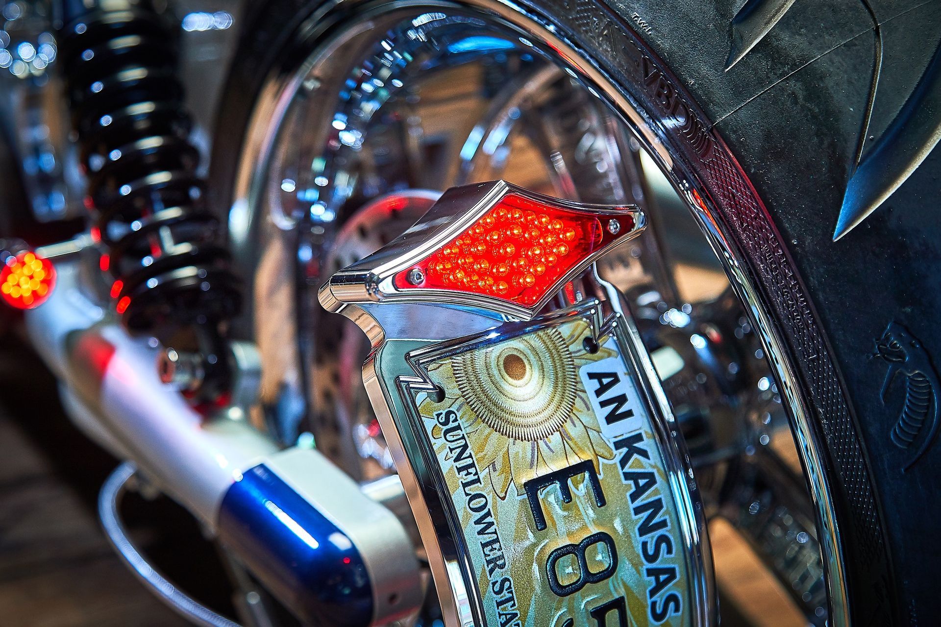 A close up of a motorcycle with an arkansas license plate