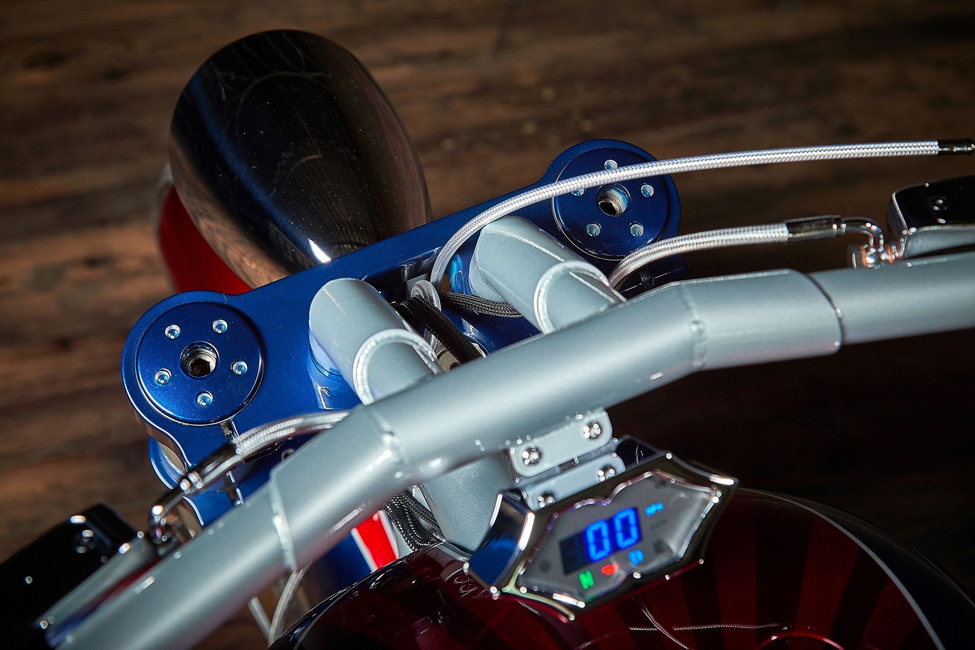 A close up of a motorcycle with a digital display that says 00
